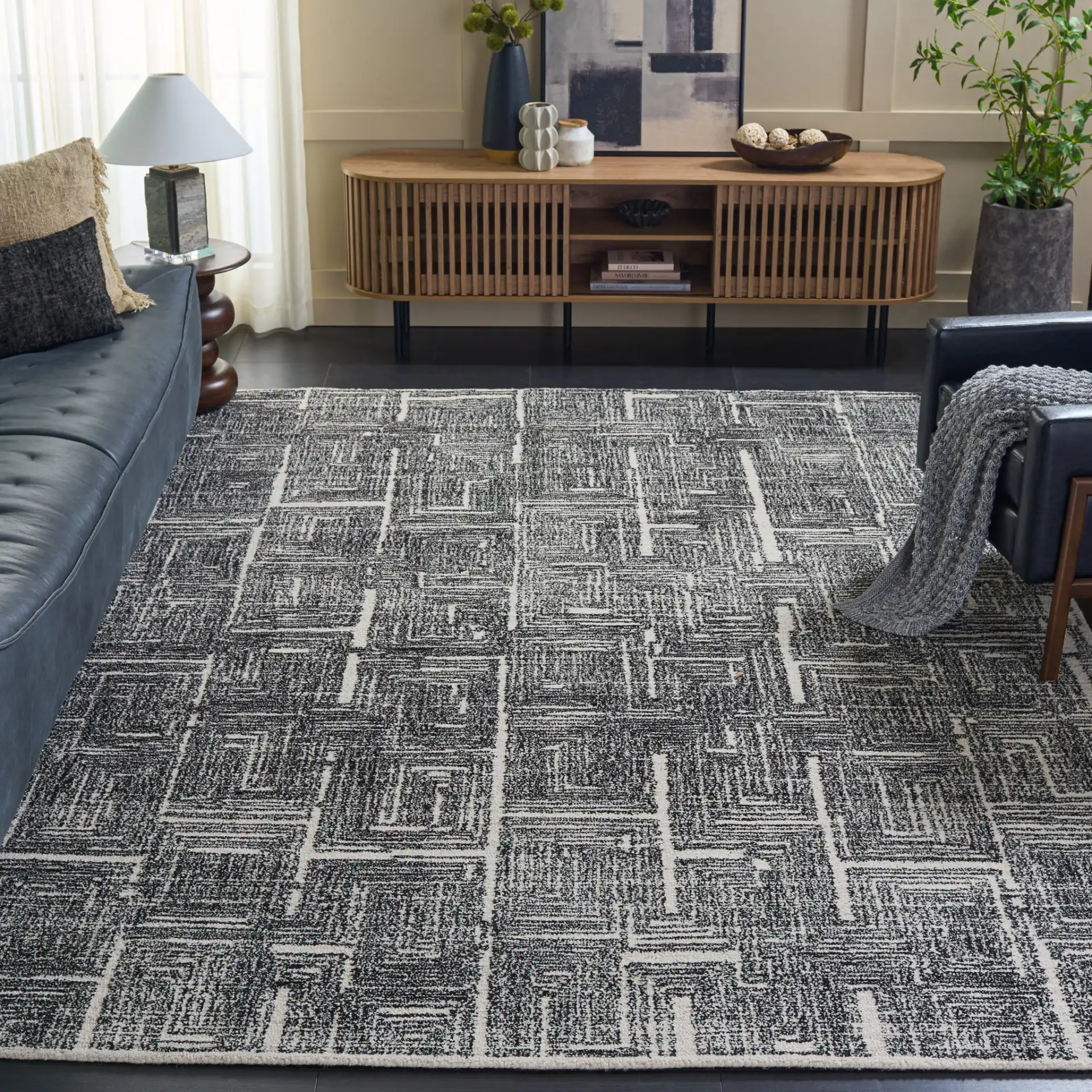 Metro Interlocking Block Hand-Tufted Wool Rug in Black / Ivory in a styled room
