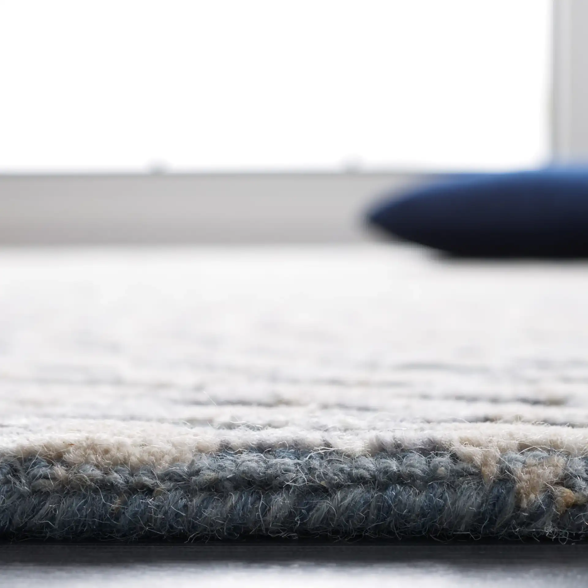 Metro Modern Concentric Ripple Hand-Tufted Wool Rug in Gray / Beige in a styled room