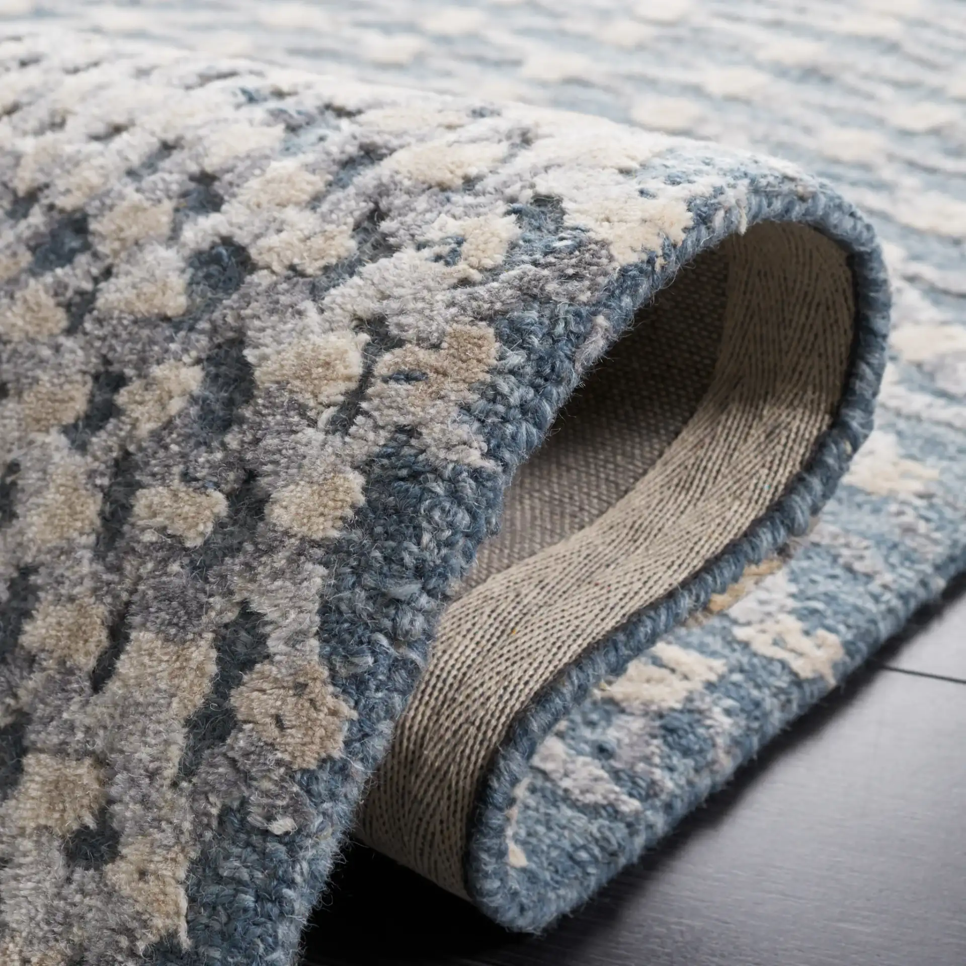 Metro Modern Concentric Ripple Hand-Tufted Wool Rug in Gray / Beige in a styled room