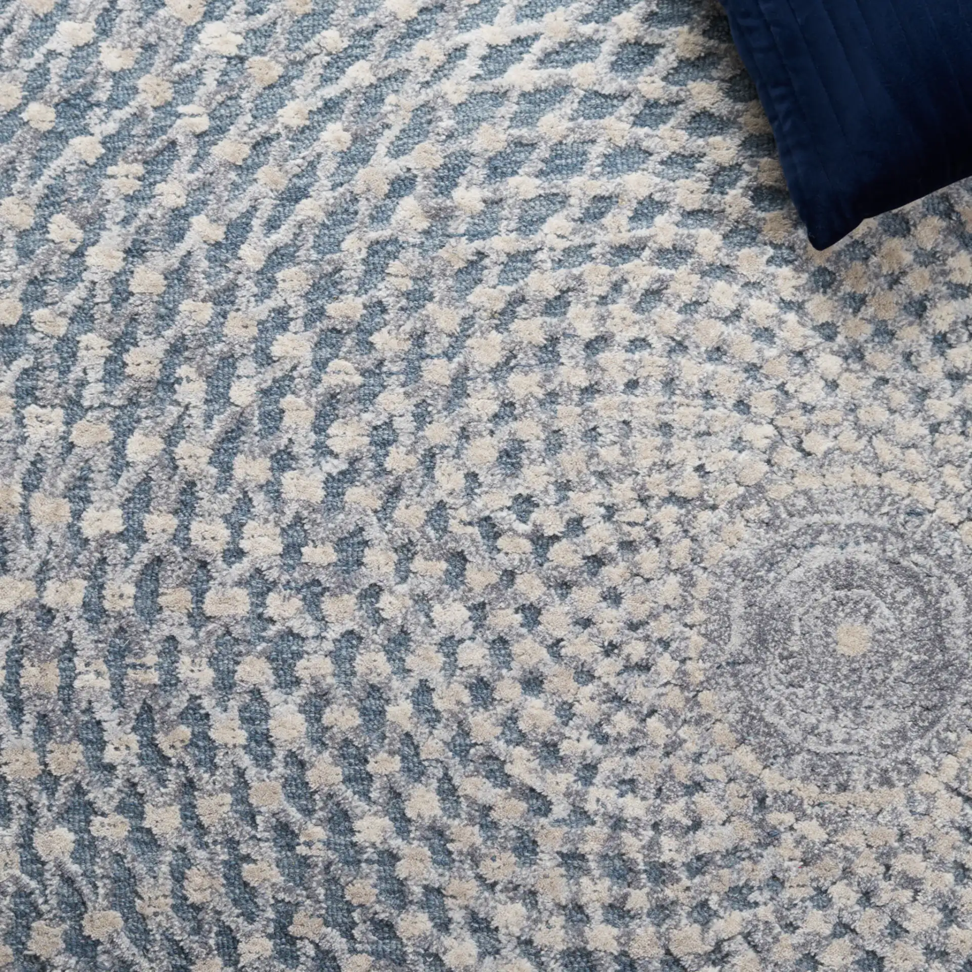 Metro Modern Concentric Ripple Hand-Tufted Wool Rug in Gray / Beige in a styled room