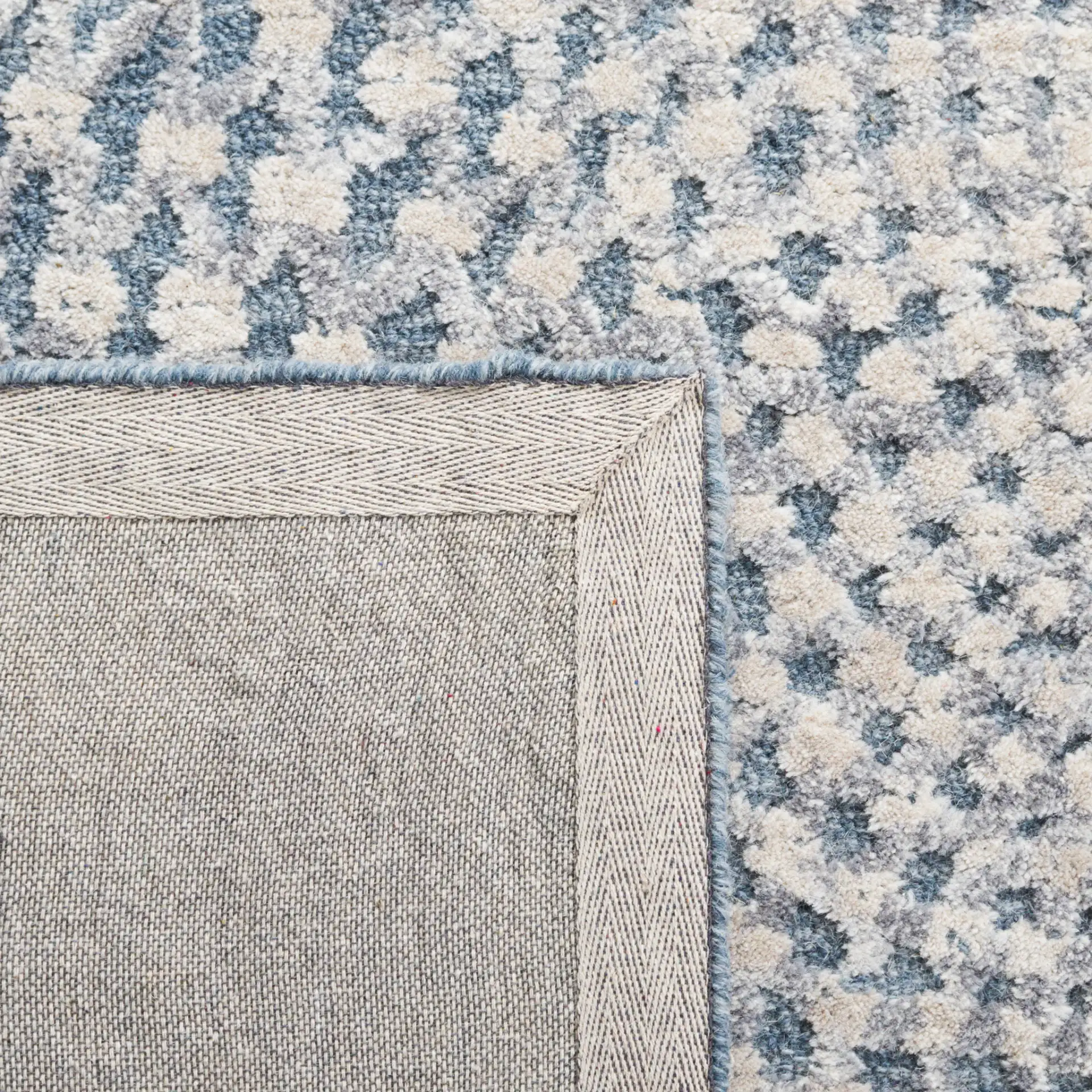 Metro Modern Concentric Ripple Hand-Tufted Wool Rug in Gray / Beige in a styled room