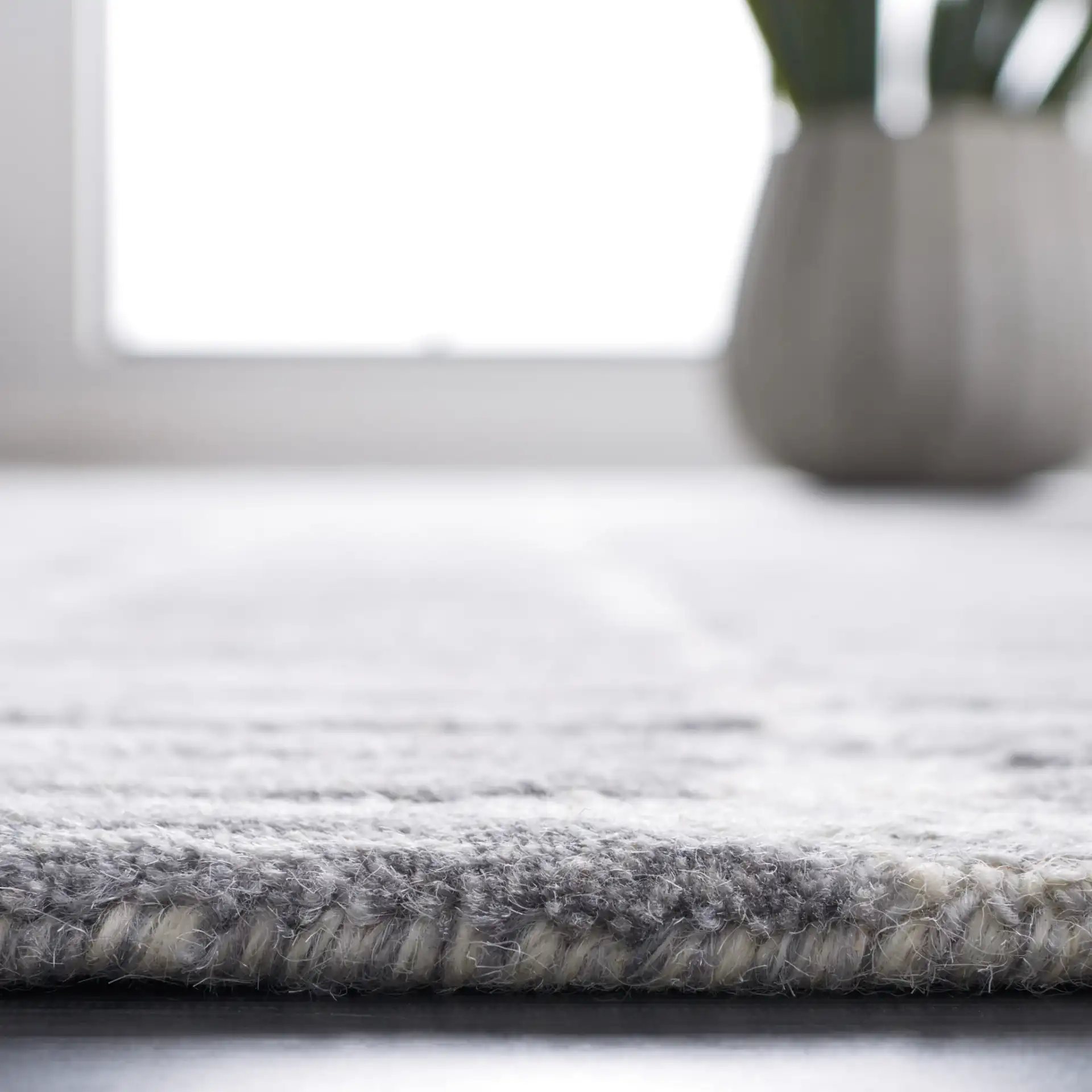 Metro Dashed Stripe Hand-Tufted Wool Rug in Silver / Gray in a styled room