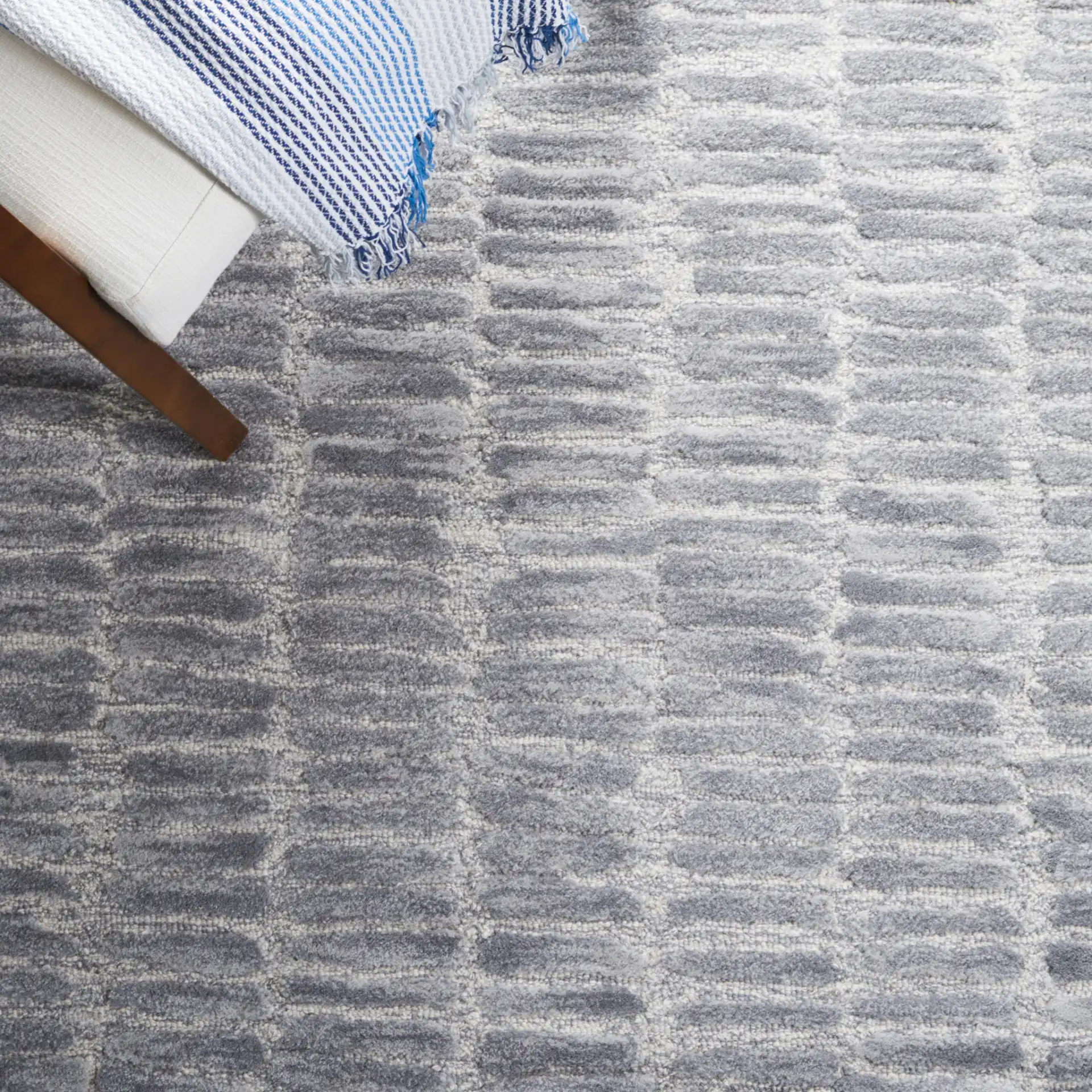 Metro Dashed Stripe Hand-Tufted Wool Rug in Silver / Gray in a styled room