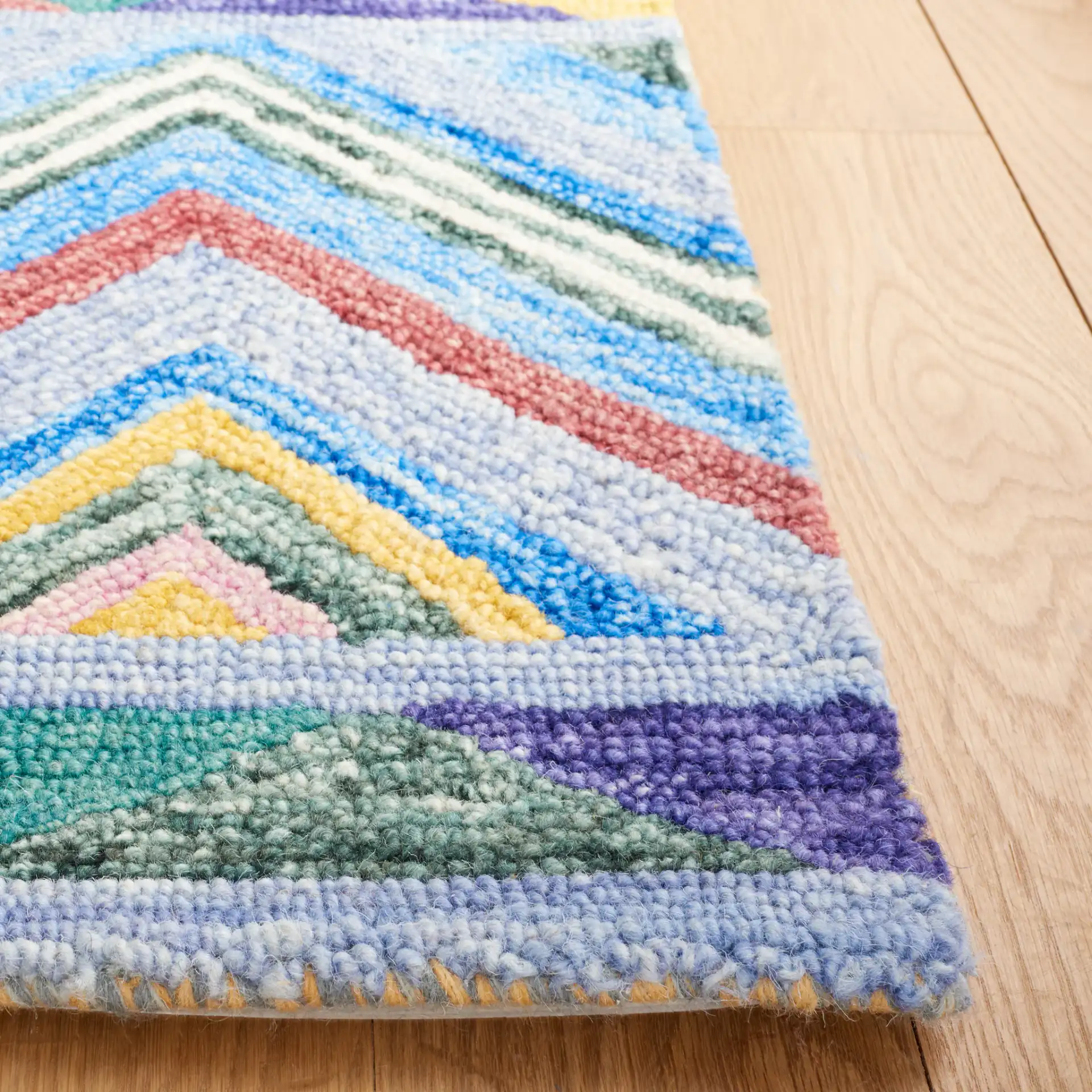 Metro Southwestern Chevron Hand-Tufted Wool Rug in Red / Blue in a styled room