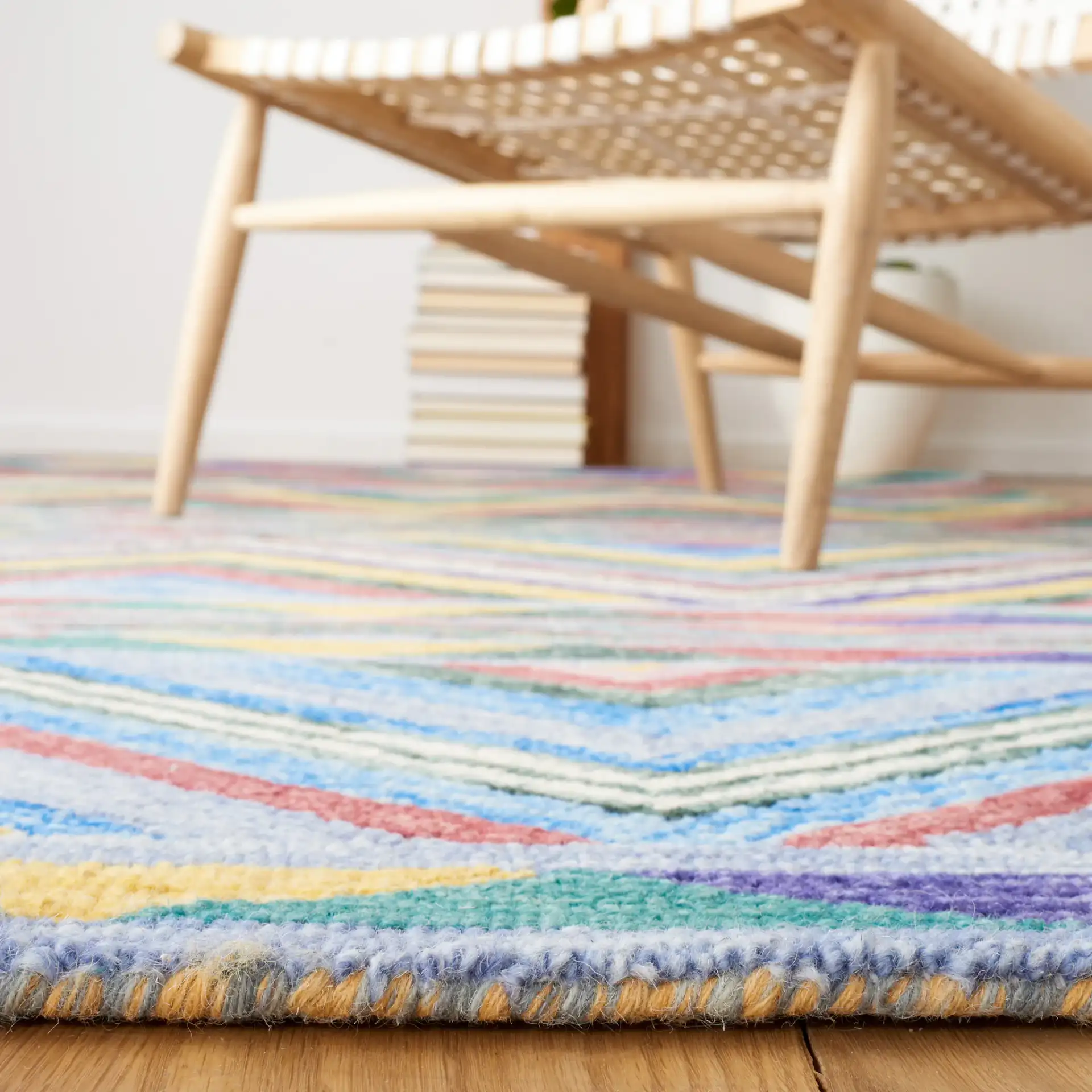 Metro Southwestern Chevron Hand-Tufted Wool Rug in Red / Blue in a styled room
