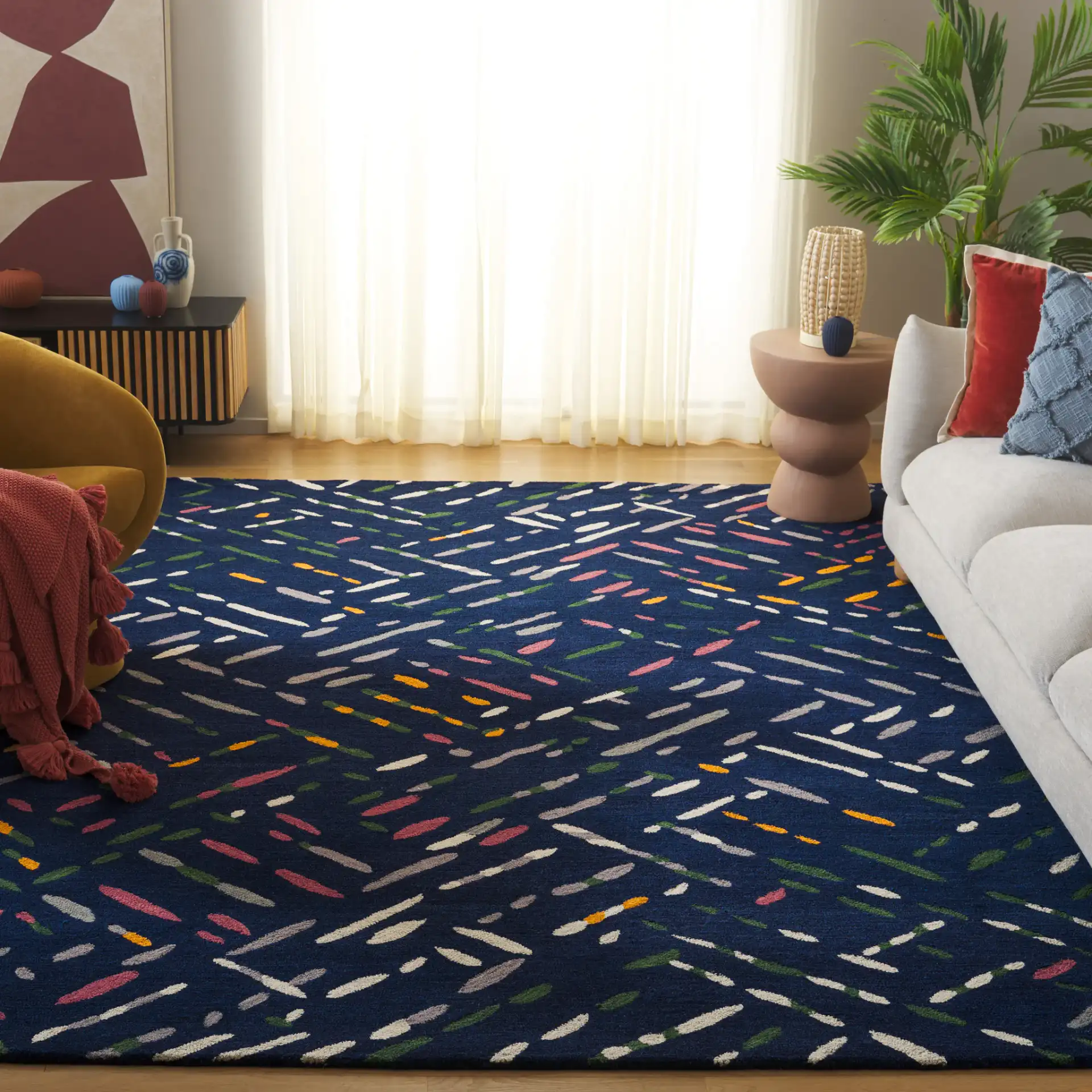 Metro Abstract Dash Hand-Tufted Wool Rug in Navy / Pink in a styled room