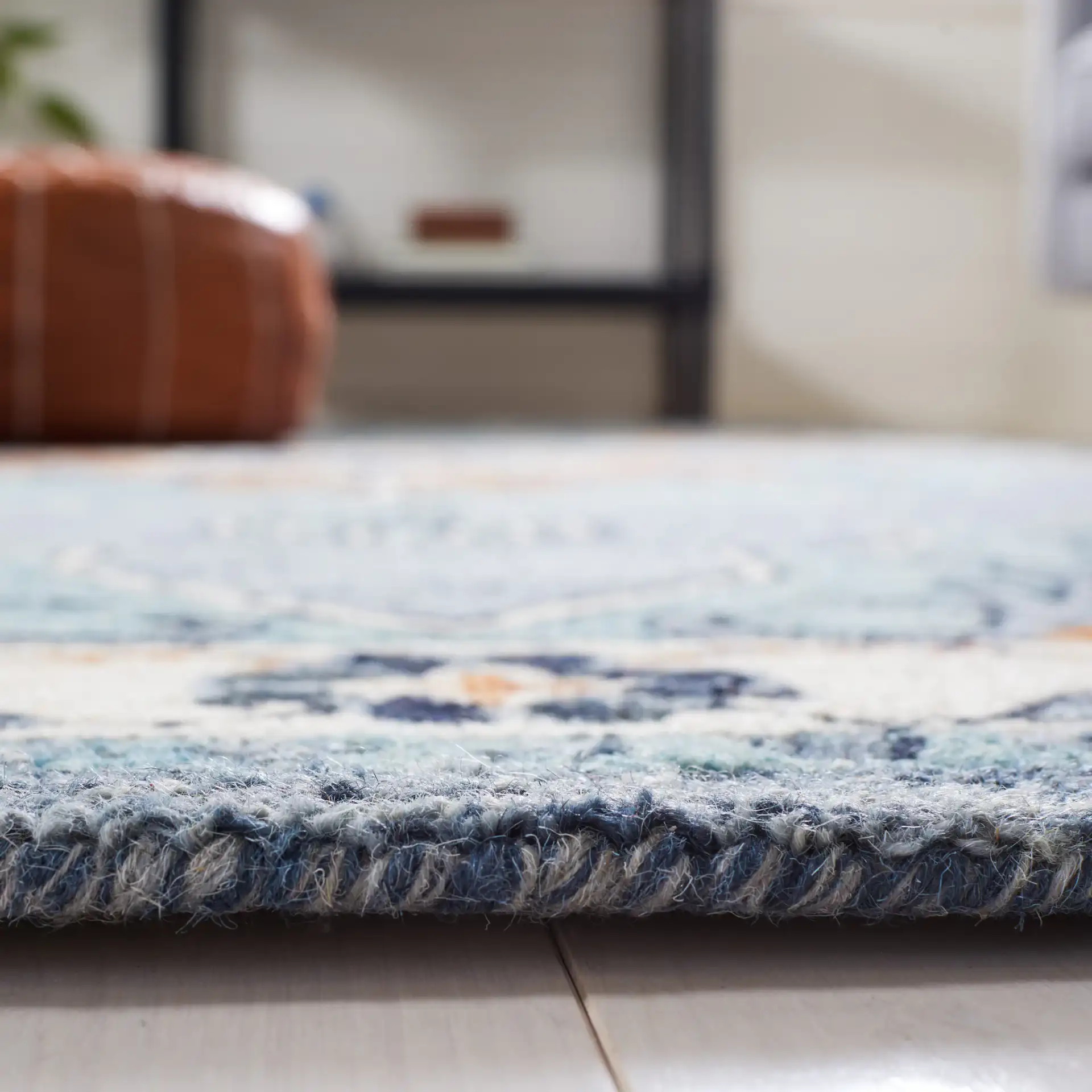 Metro Concentric Stepped Medallion Hand-Tufted Wool Rug in Blue / Ivory in a styled room