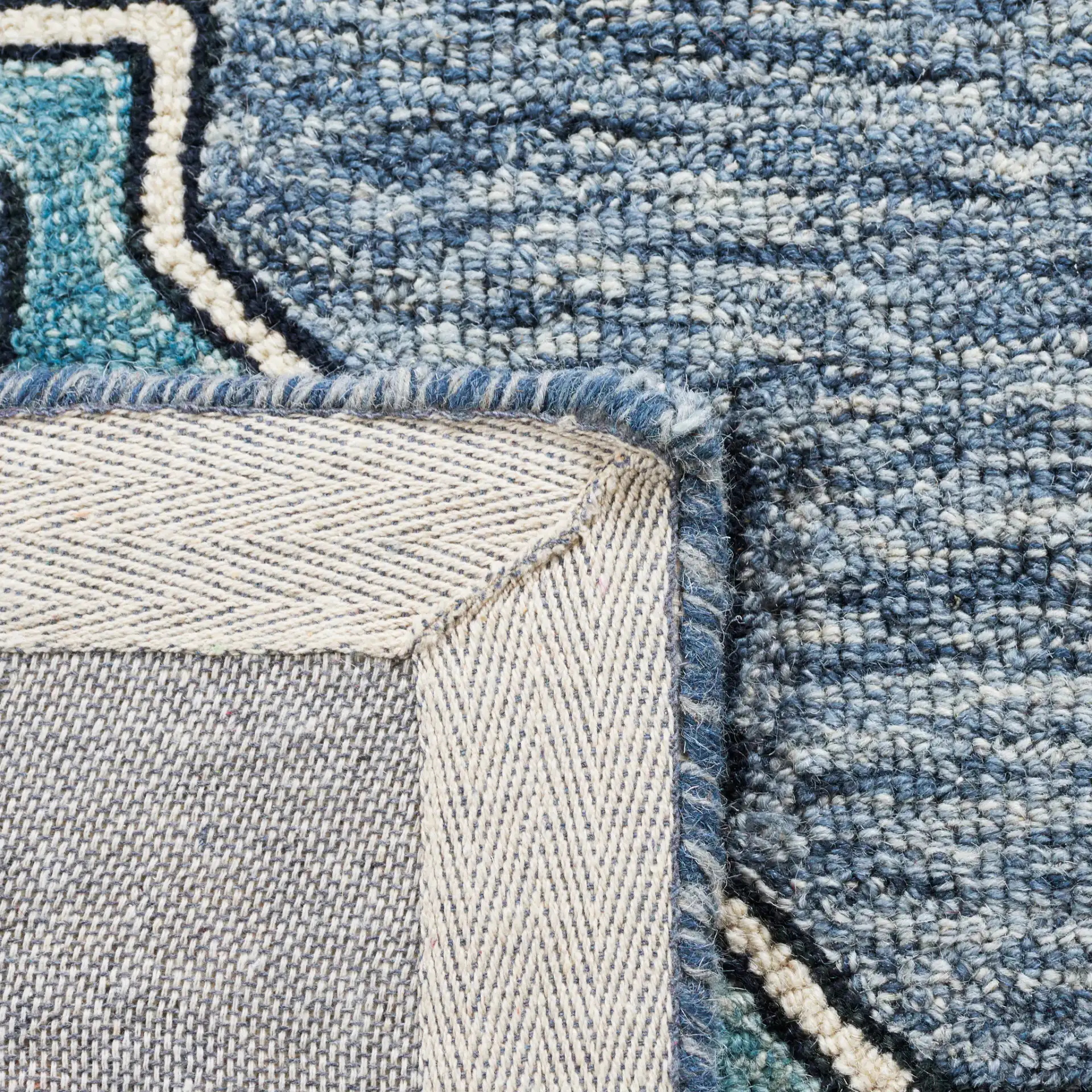Metro Concentric Stepped Medallion Hand-Tufted Wool Rug in Blue / Ivory in a styled room