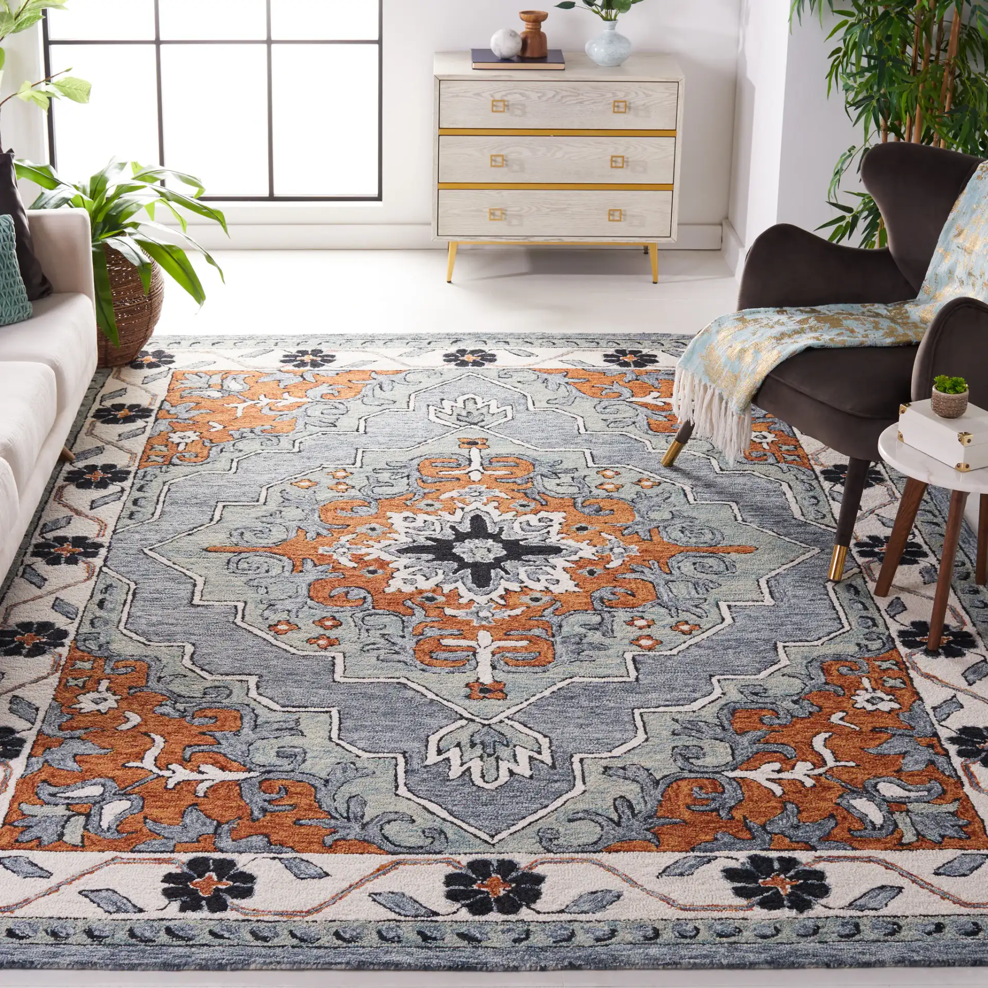 Metro Concentric Stepped Medallion Hand-Tufted Wool Rug in Blue / Ivory in a styled room