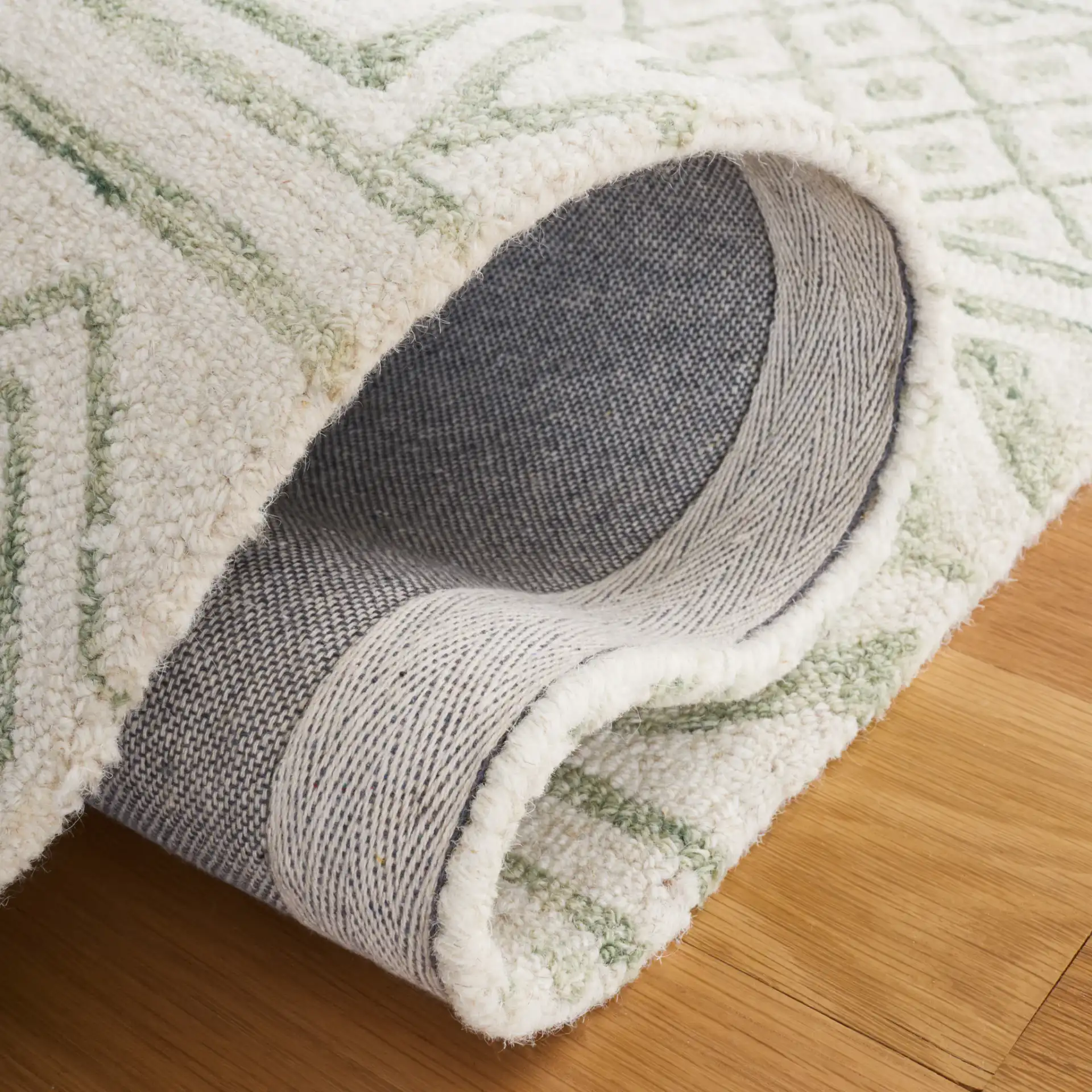 Metro Geometric Banded Hand-Tufted Wool Rug in Ivory / Light Green in a styled room