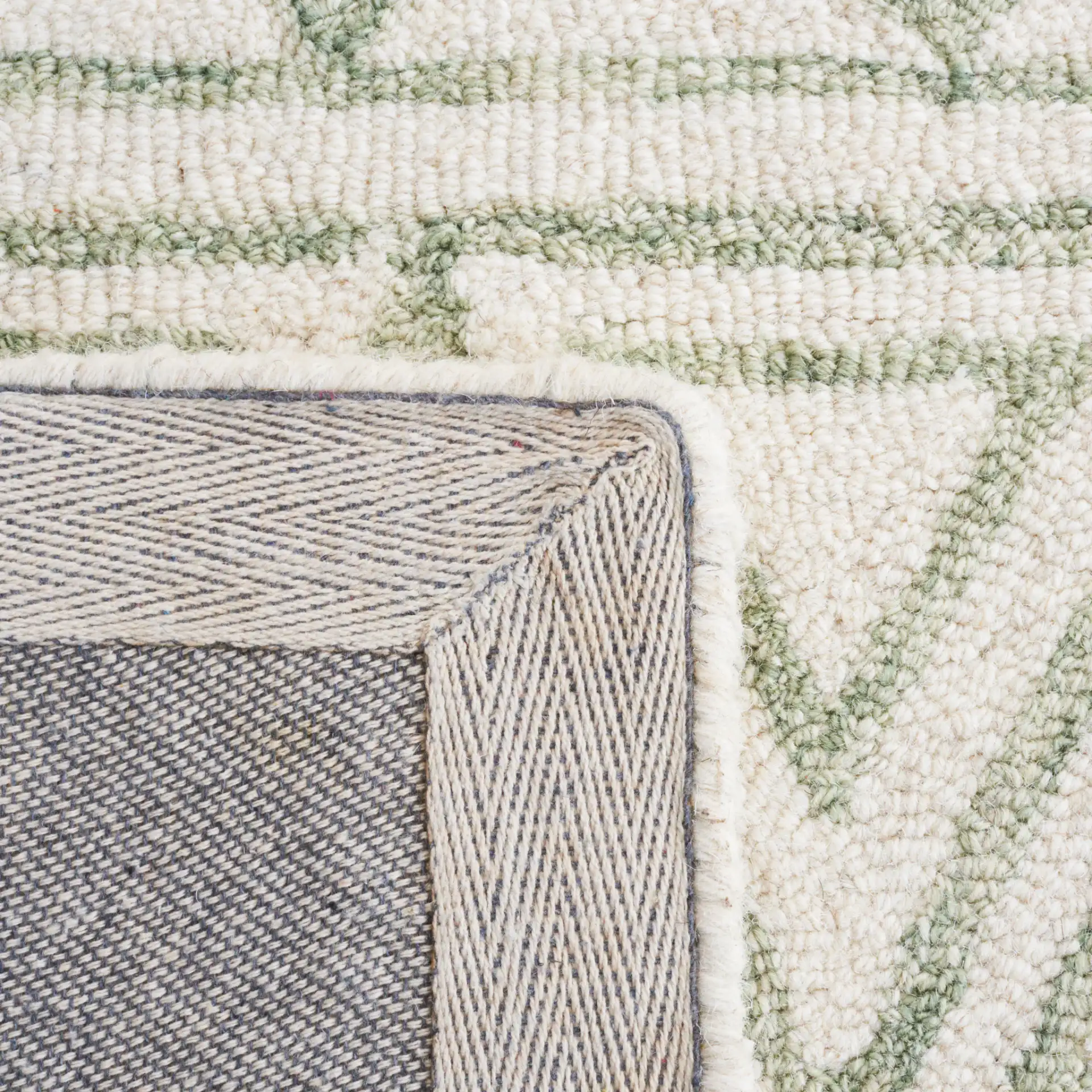 Metro Geometric Banded Hand-Tufted Wool Rug in Ivory / Light Green in a styled room