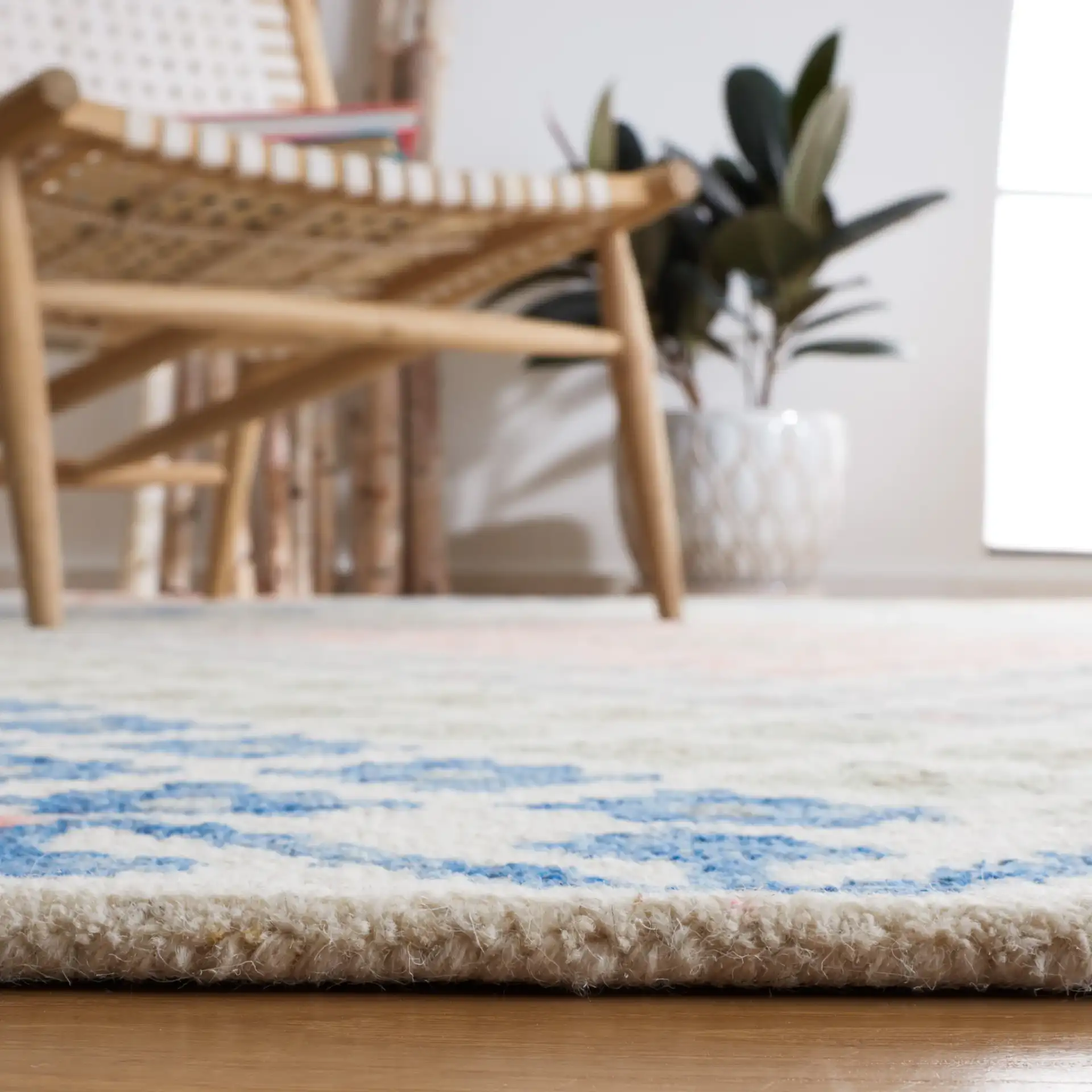 Metro Tribal Chevron Hand-Tufted Wool Rug in Ivory / Blue in a styled room