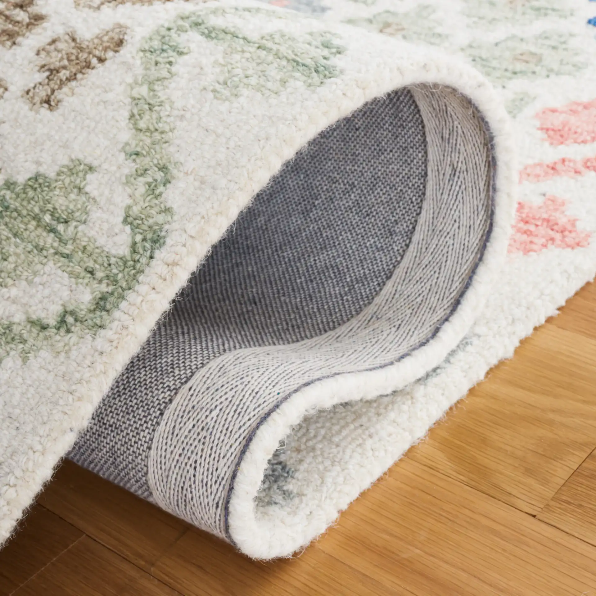 Metro Tribal Chevron Hand-Tufted Wool Rug in Ivory / Blue in a styled room