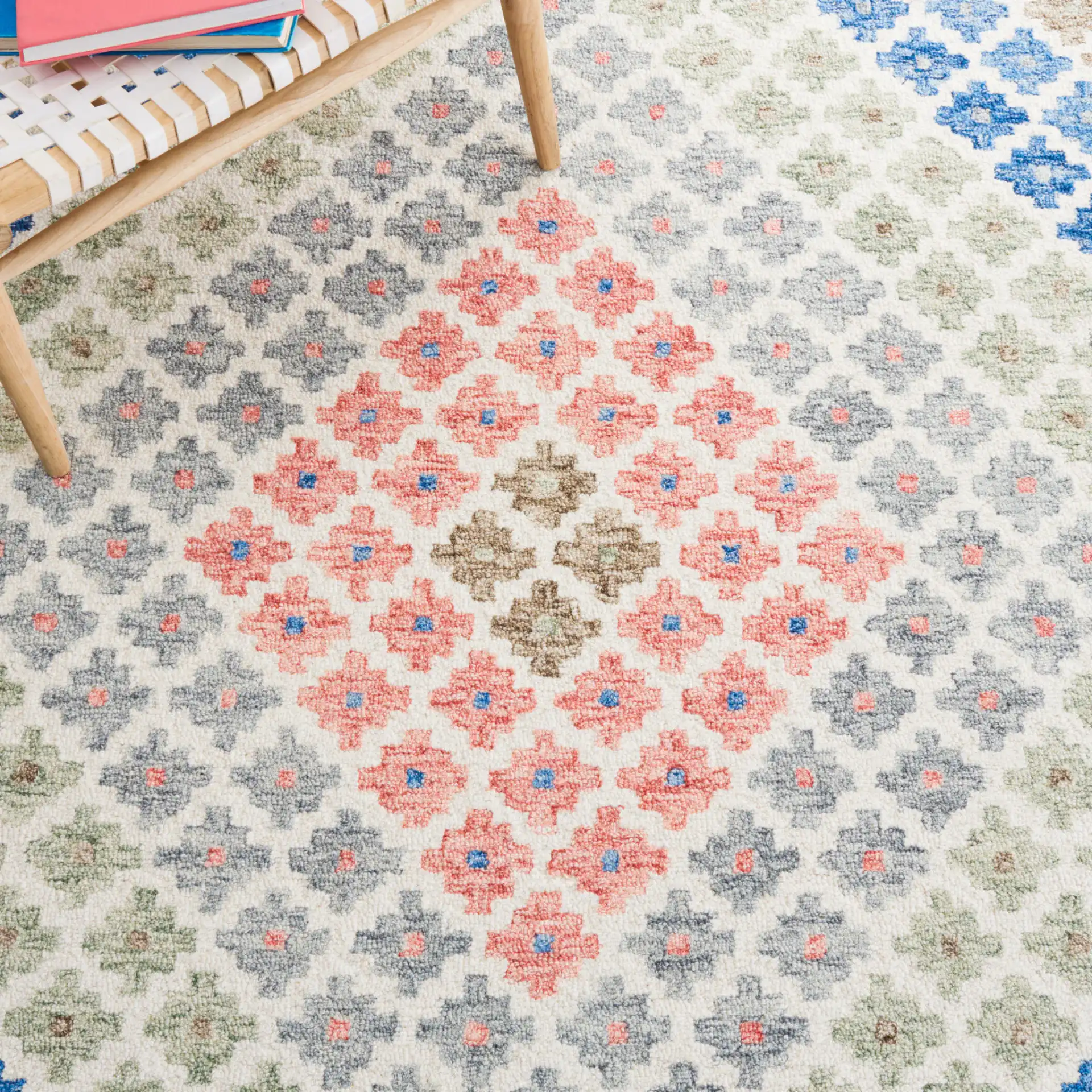 Metro Tribal Chevron Hand-Tufted Wool Rug in Ivory / Blue in a styled room