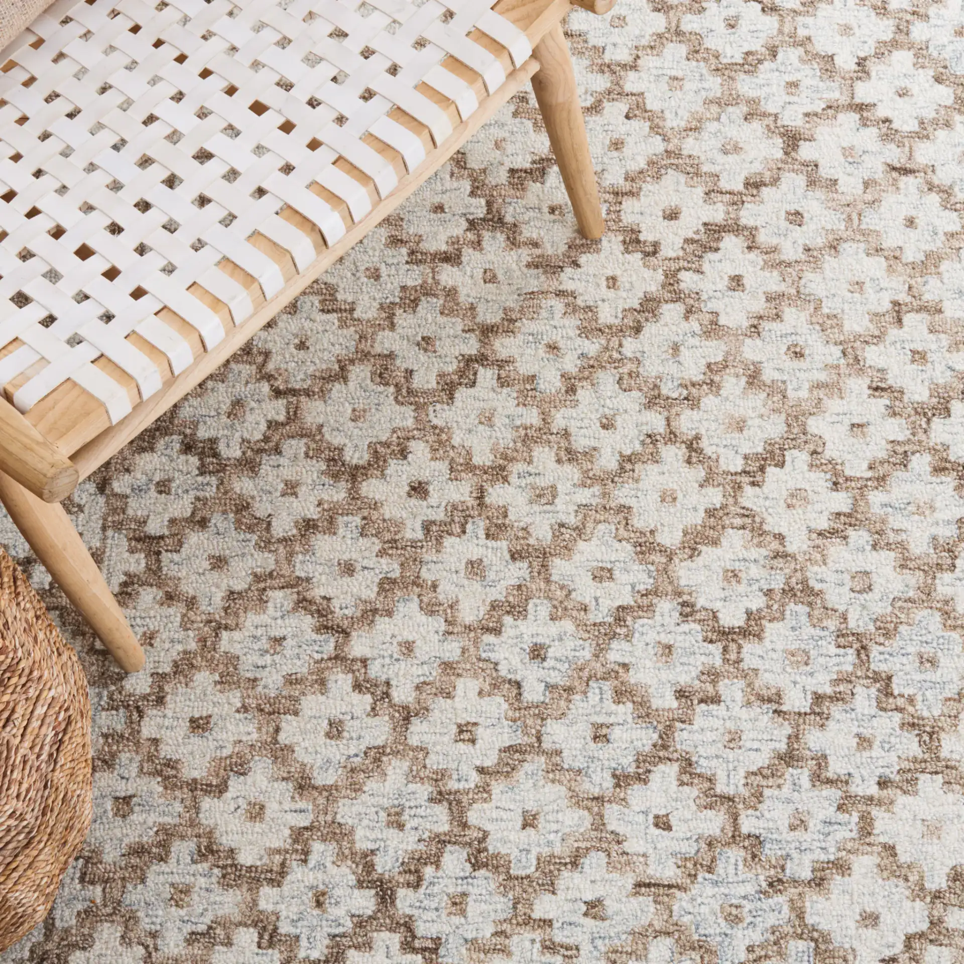 Metro Trellis Border Hand-Tufted Wool Rug in Beige / Sage in a styled room