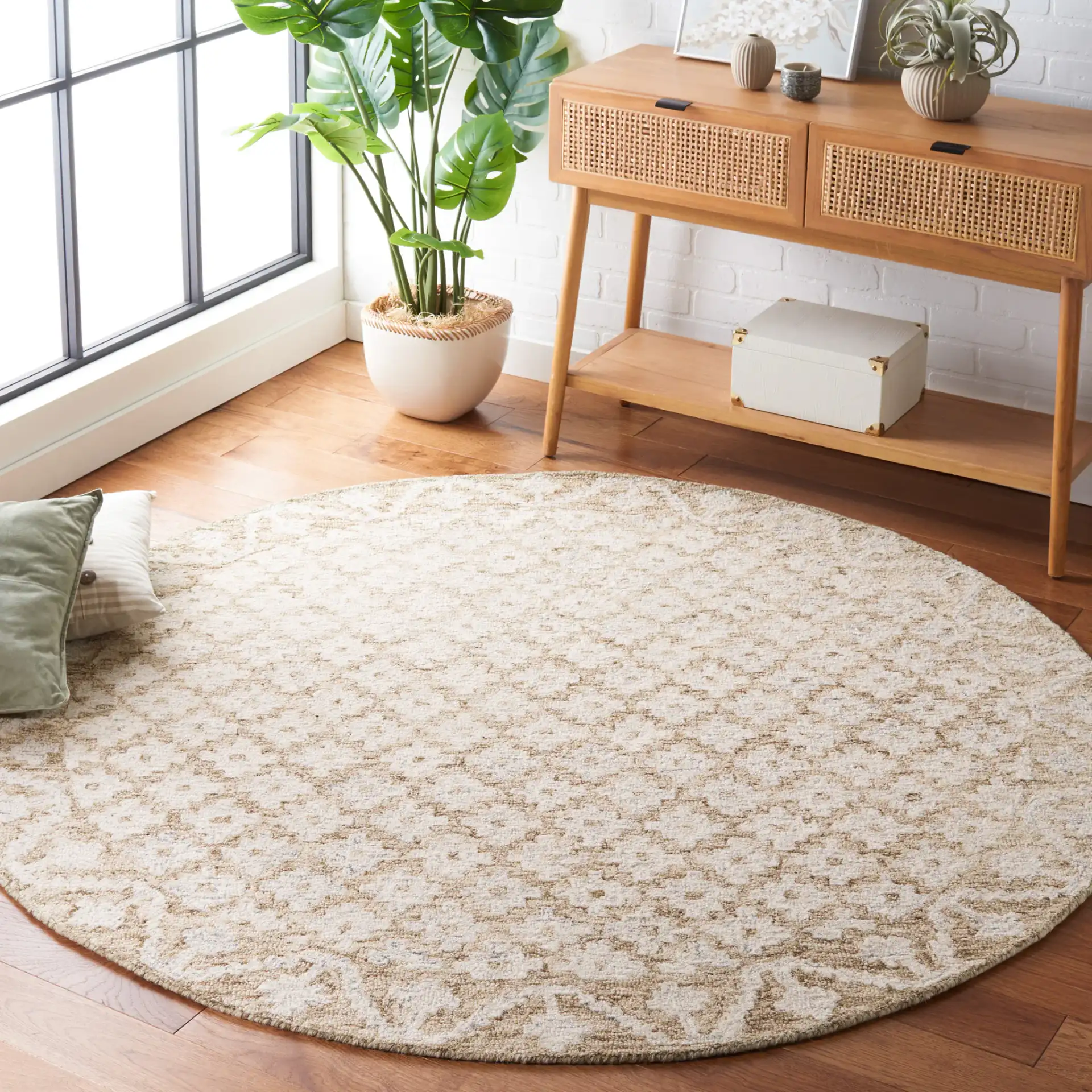 Metro Trellis Border Hand-Tufted Wool Rug in Beige / Sage in a styled room