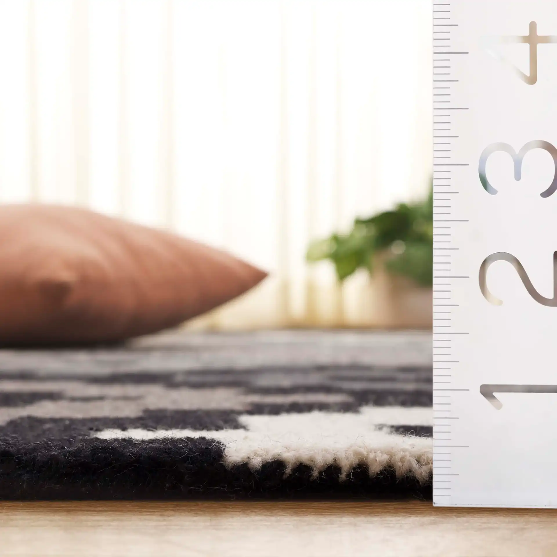 Metro Stepped Geometric Hand-Tufted Wool Rug in Black / Ivory in a styled room