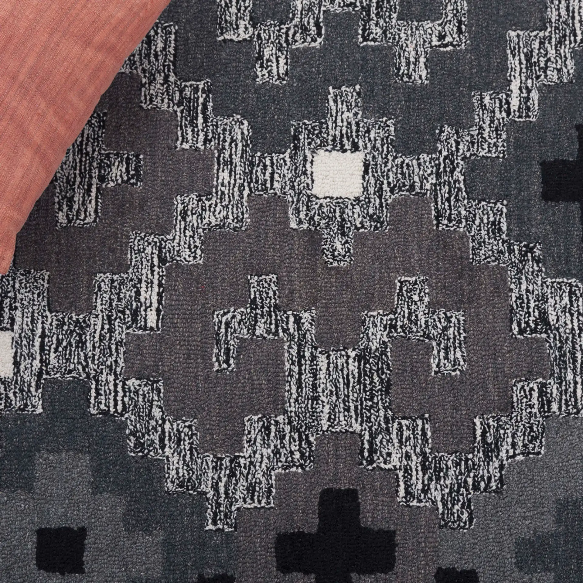 Metro Stepped Geometric Hand-Tufted Wool Rug in Black / Ivory in a styled room