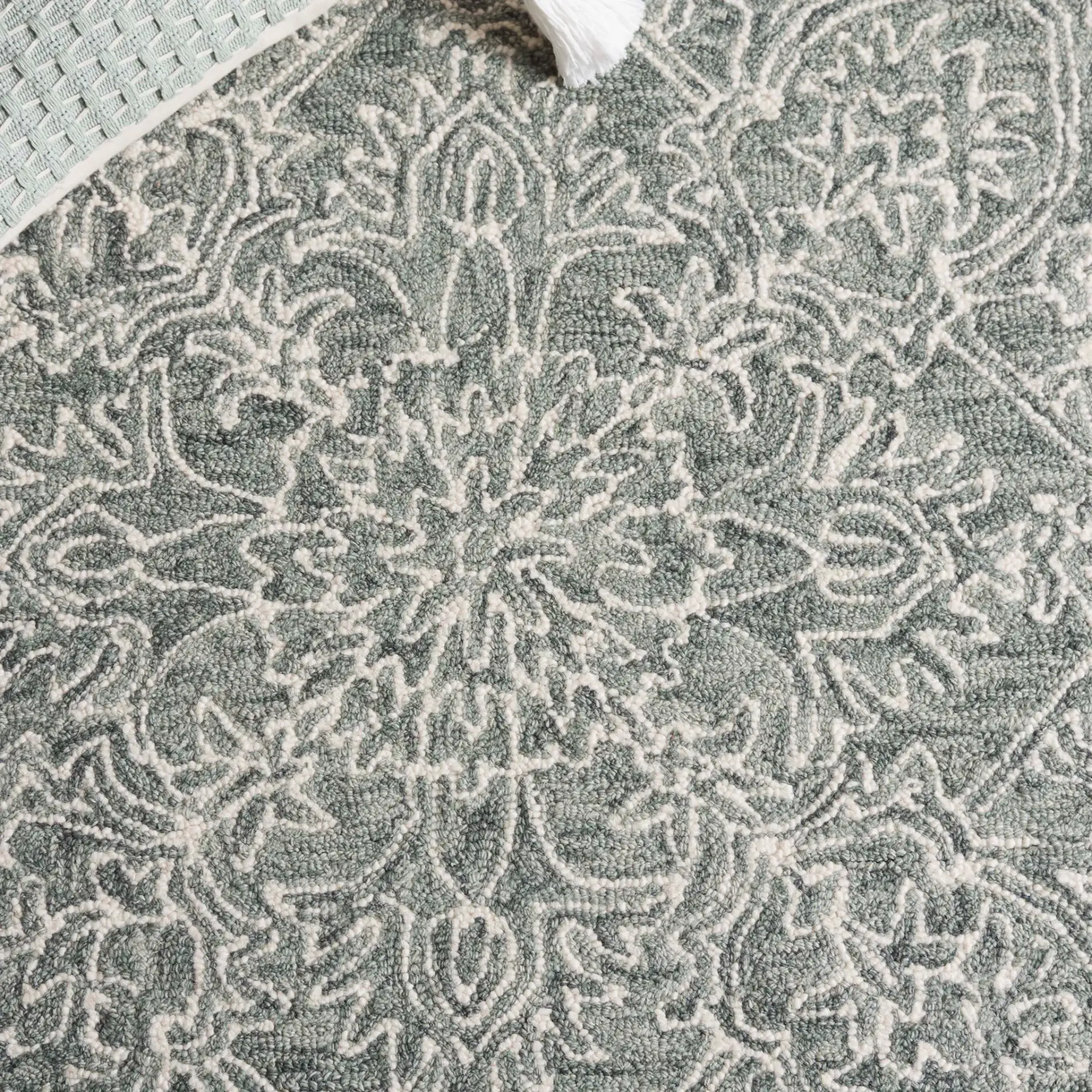 Metro Linear Medallion Hand-Tufted Wool Rug in Green / Ivory in a styled room
