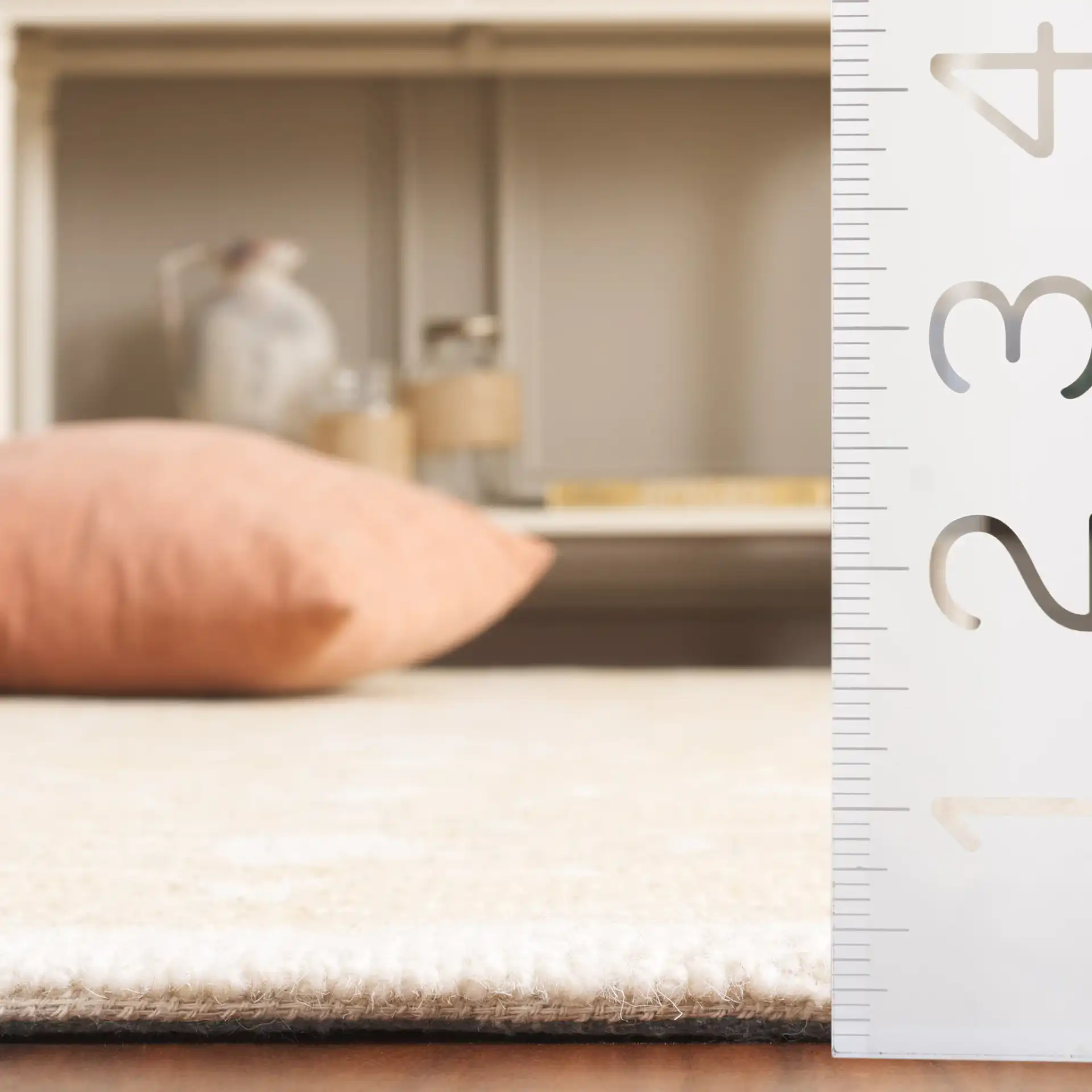 Metro Radial Medallion Hand-Tufted Wool Rug in Gold / Ivory in a styled room
