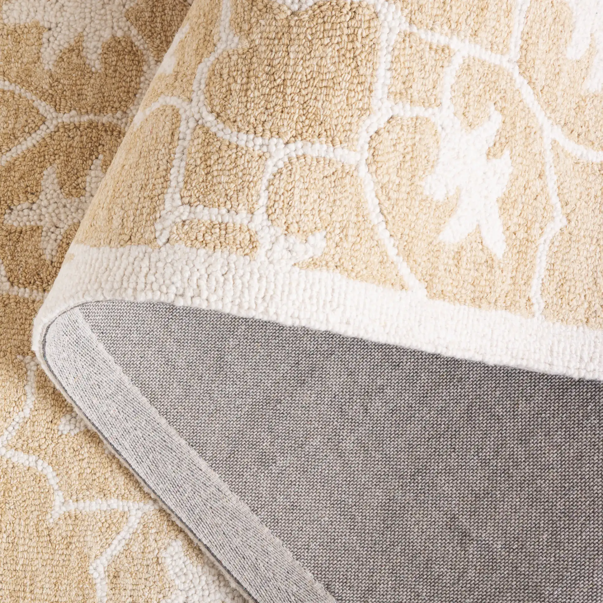 Metro Radial Medallion Hand-Tufted Wool Rug in Gold / Ivory in a styled room