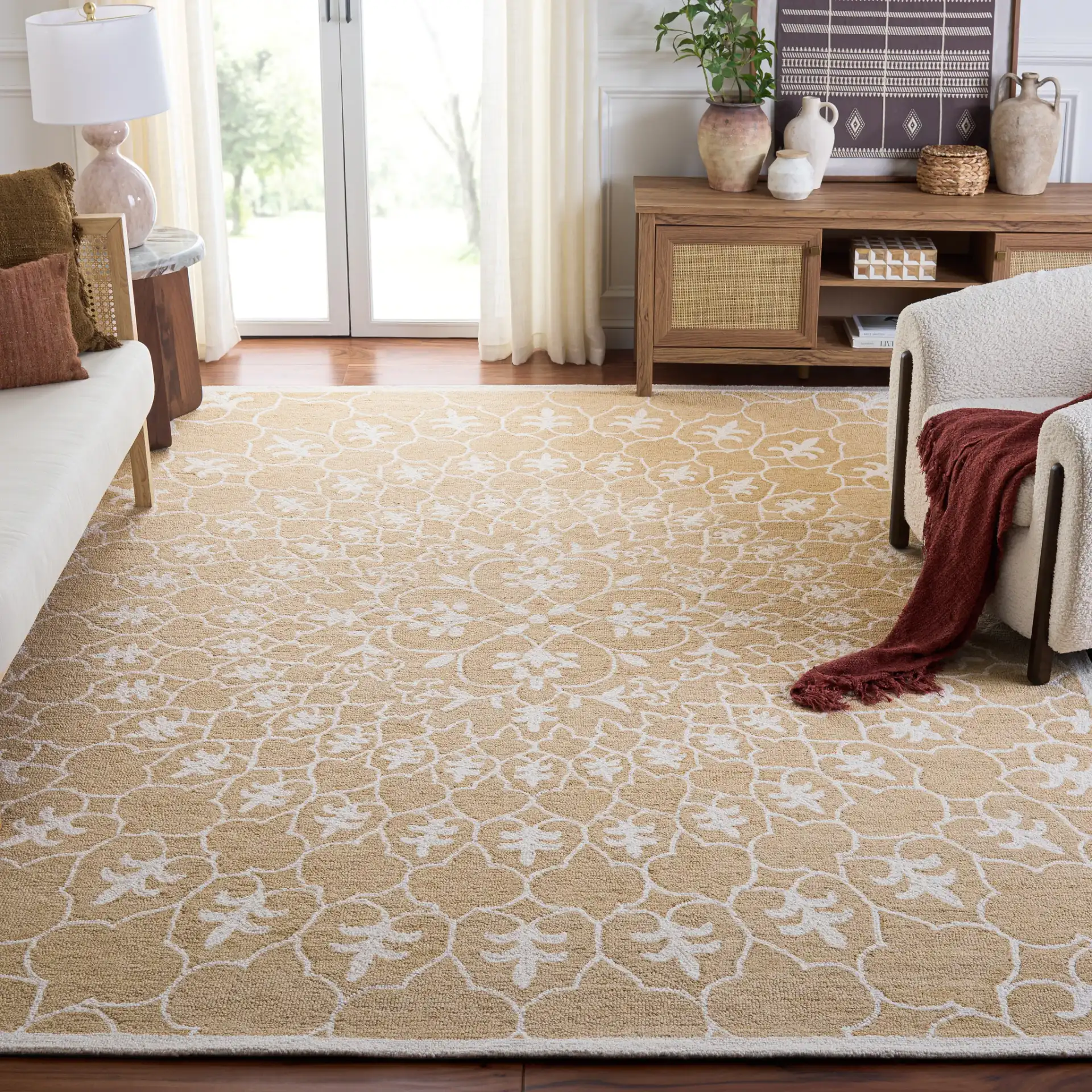 Metro Radial Medallion Hand-Tufted Wool Rug in Gold / Ivory in a styled room