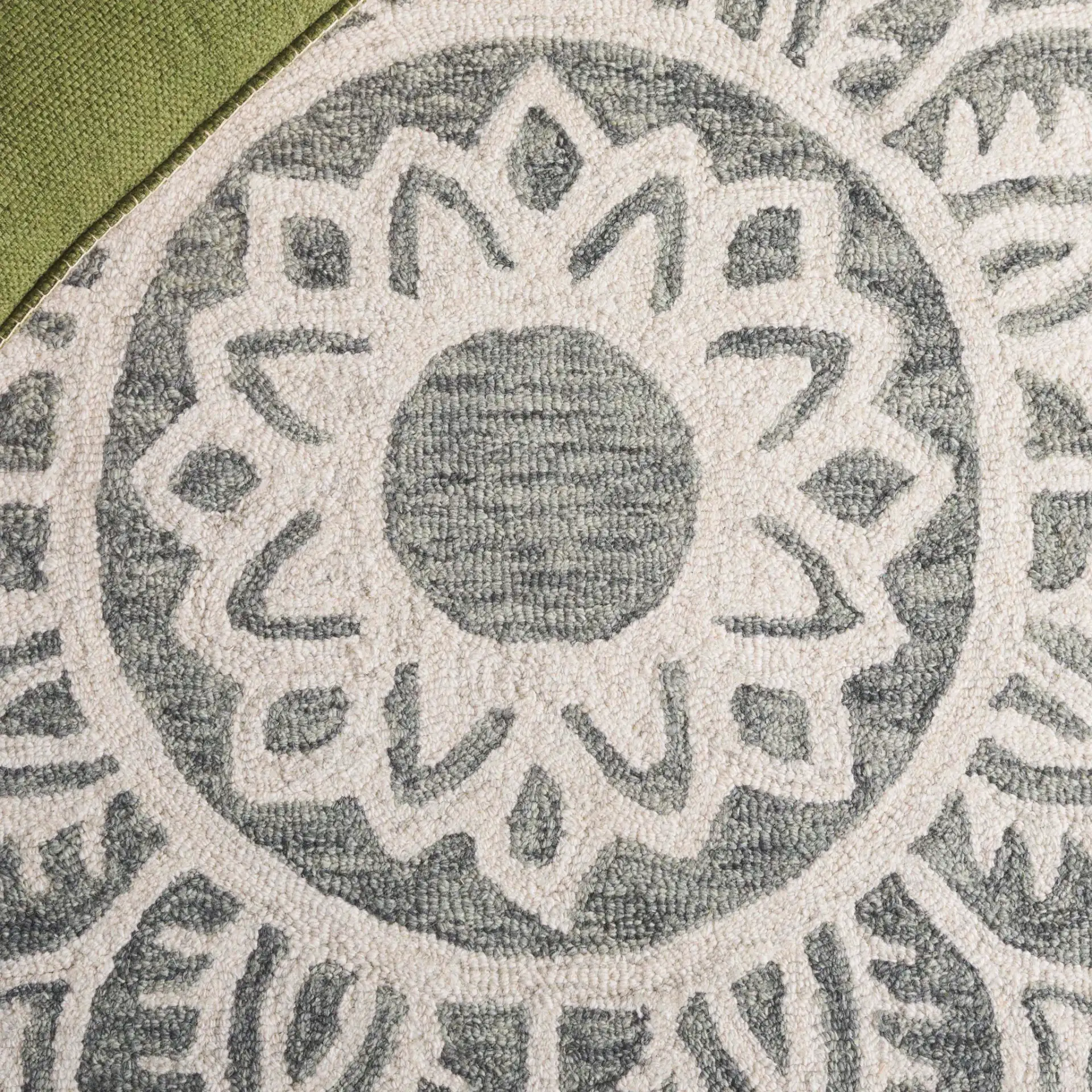 Metro Mandala Medallion Hand-Tufted Wool Rug in Green / Ivory in a styled room