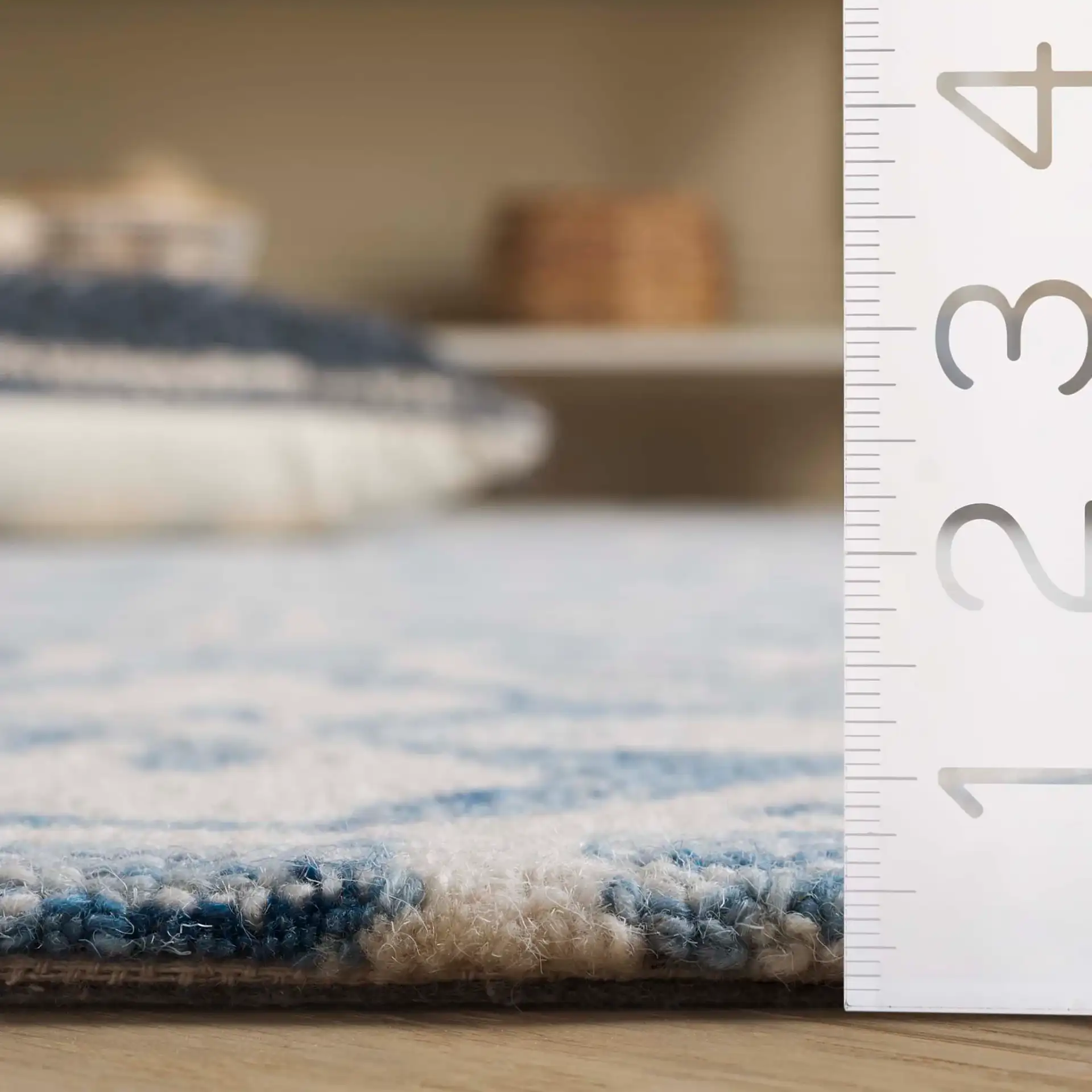 Metro Floral Tile Hand-Tufted Wool Rug in Ivory / Blue in a styled room
