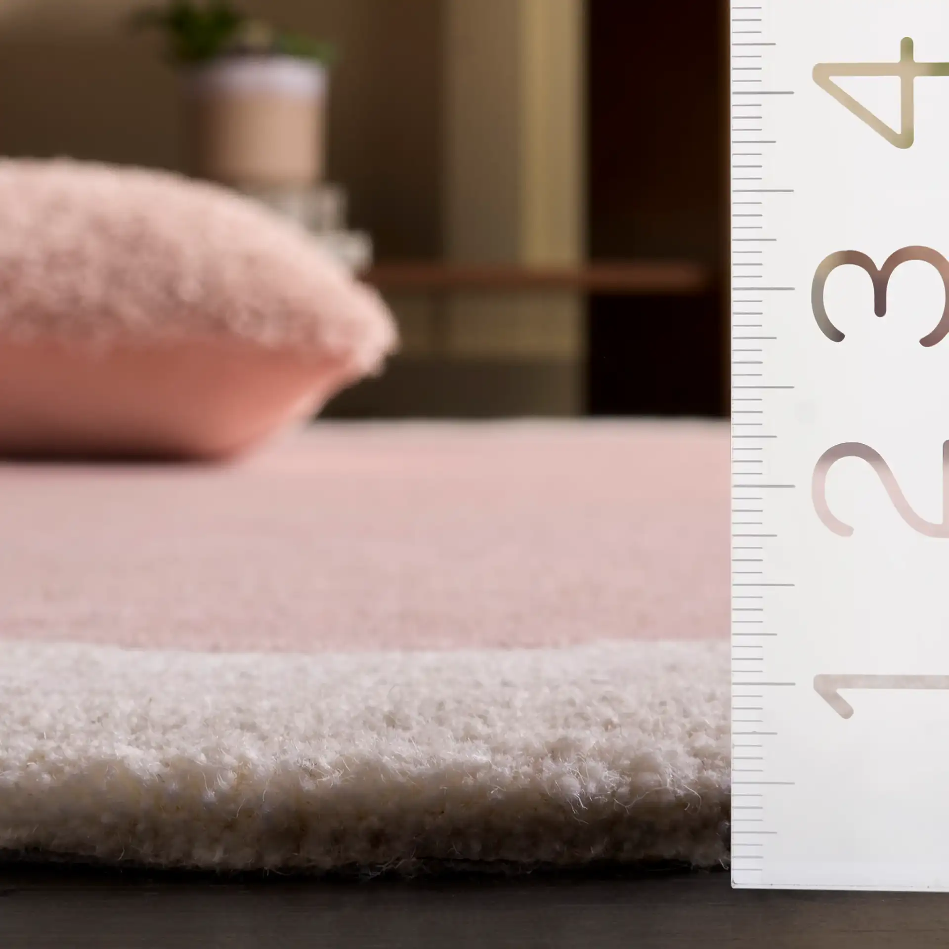 Metro Modern Scalloped Border Hand-Tufted Wool Rug in Pink / Ivory in a styled room