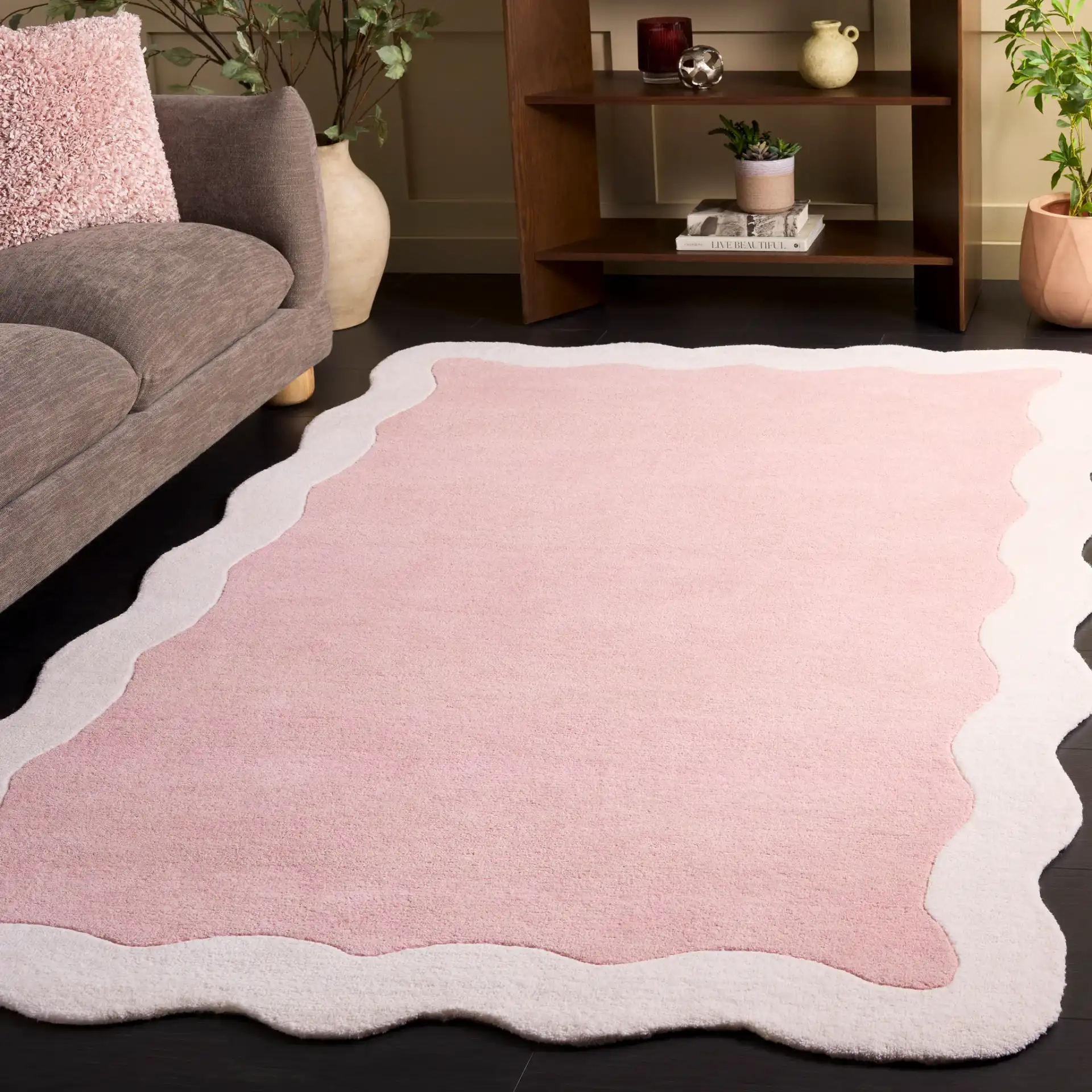 Metro Modern Scalloped Border Hand-Tufted Wool Rug in Pink / Ivory in a styled room