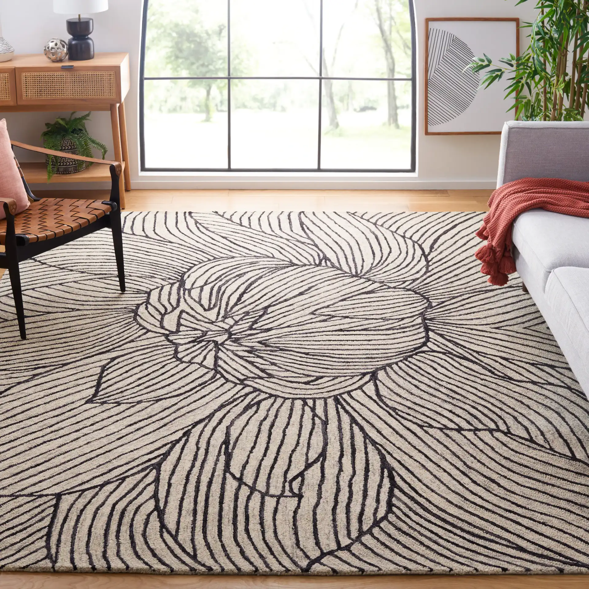 Metro Blooming Flower Hand-Tufted Wool Rug in Black / Ivory in a styled room