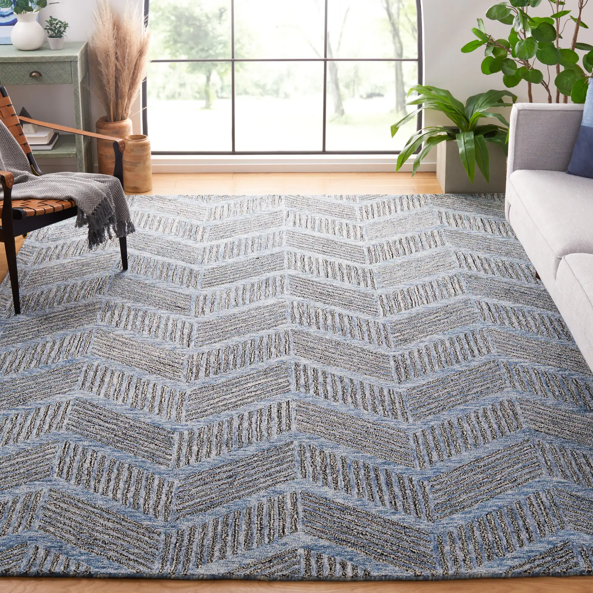 Metro Modern Chevron Hand-Tufted Wool Rug in Blue / Black in a styled room