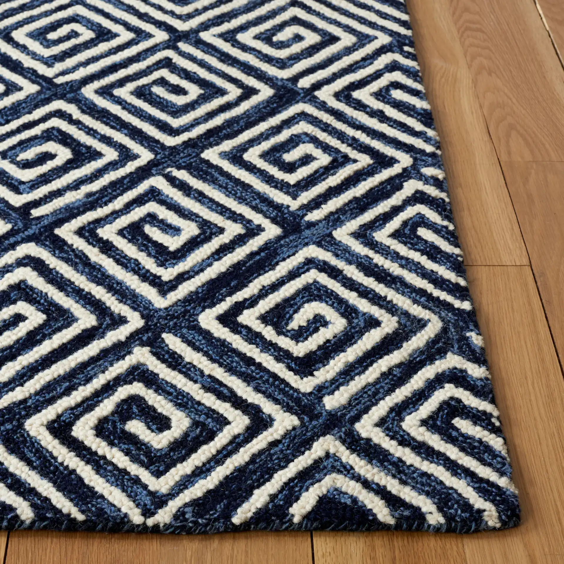 Metro Maze Hand-Tufted Wool Rug in Navy / Ivory in a styled room