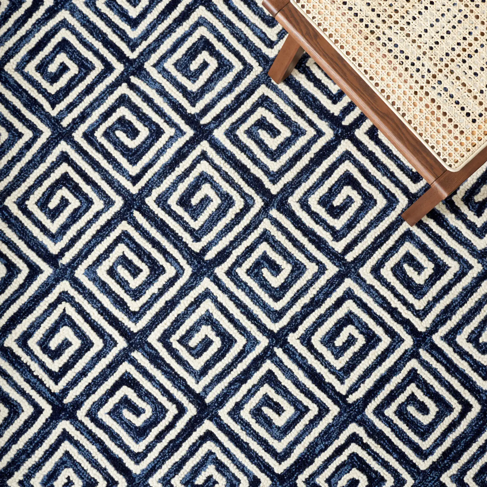 Metro Maze Hand-Tufted Wool Rug in Navy / Ivory in a styled room