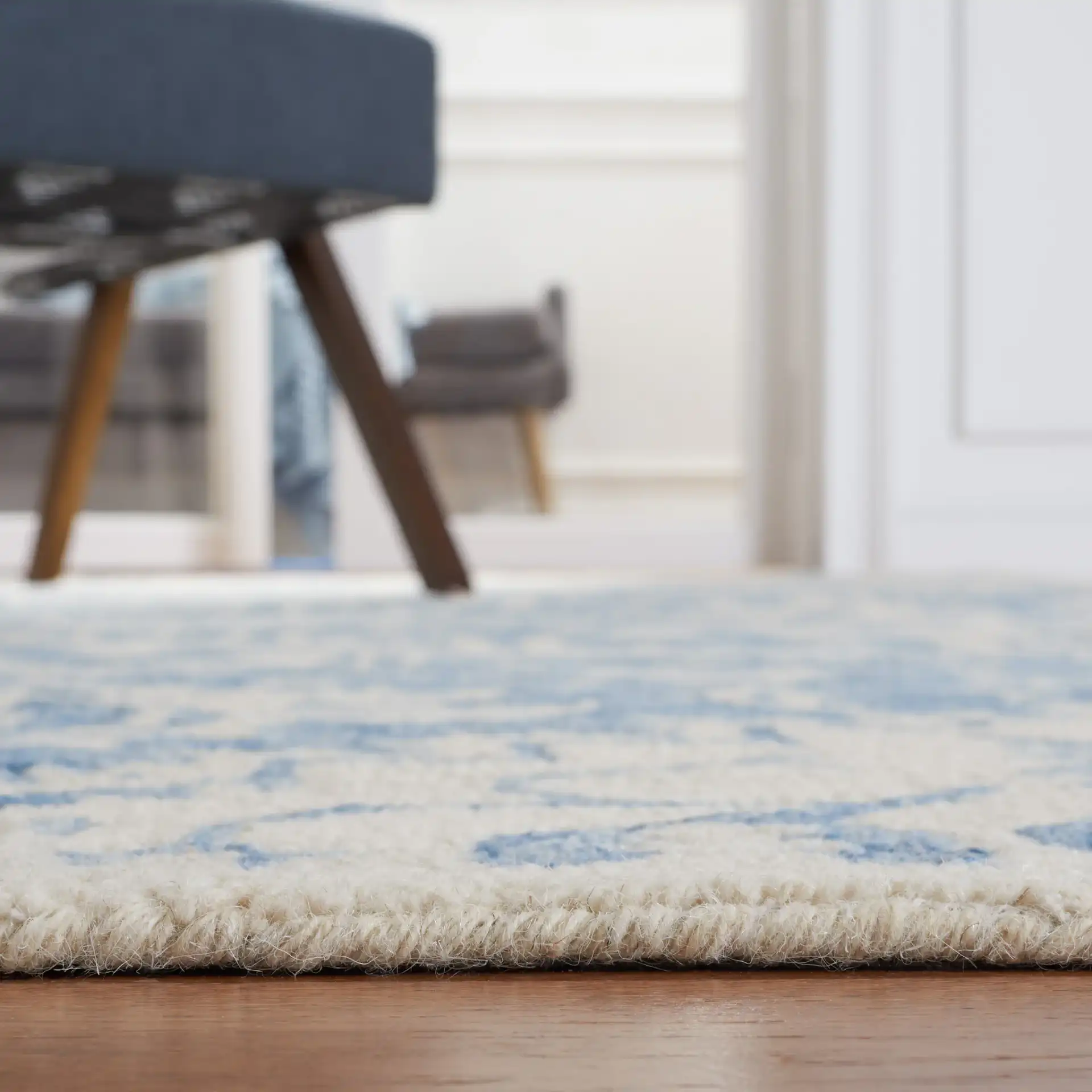 Metro Geometric Medallion Hand-Tufted Wool Rug in Blue / Ivory in a styled room