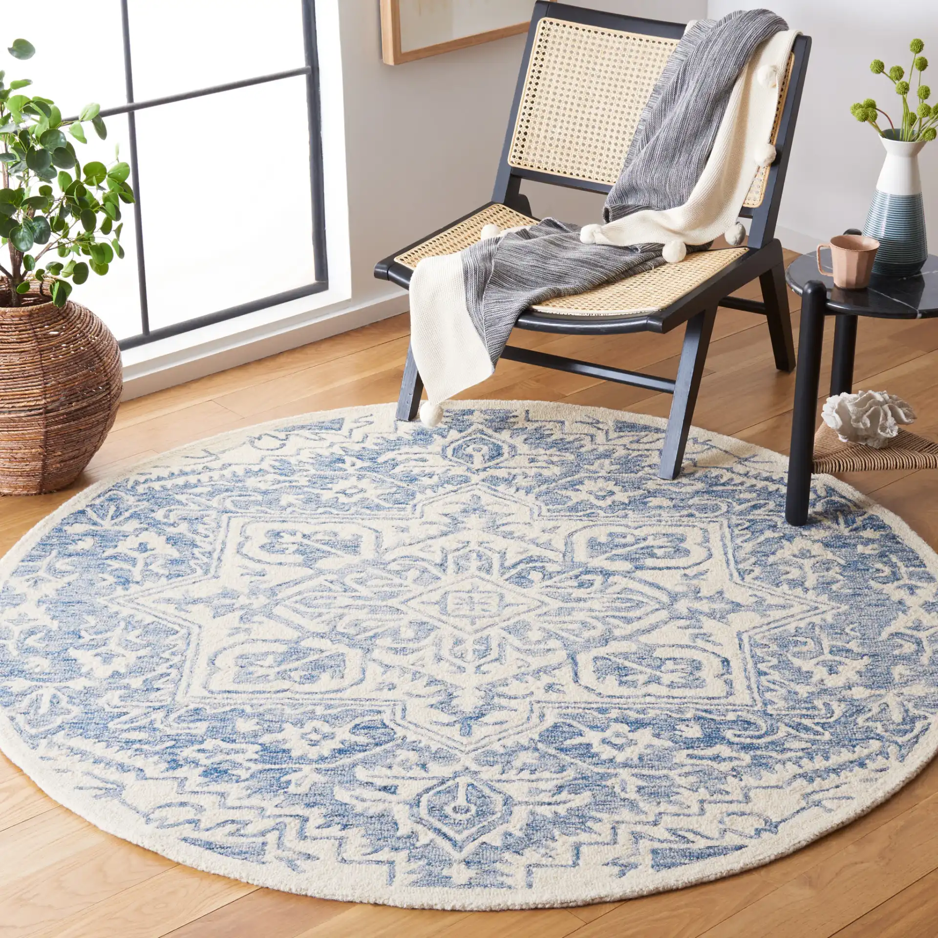 Metro Geometric Medallion Hand-Tufted Wool Rug in Blue / Ivory in a styled room