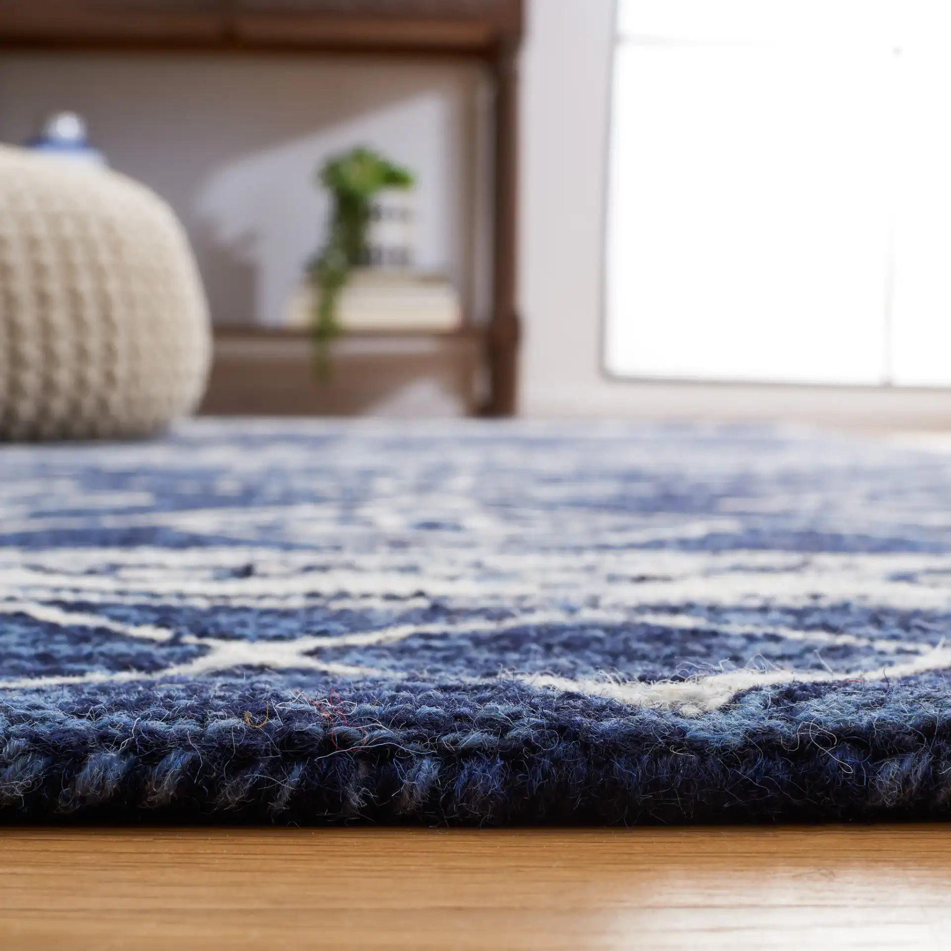 Metro Diamond Banded Hand-Tufted Wool Rug in Navy / Ivory in a styled room