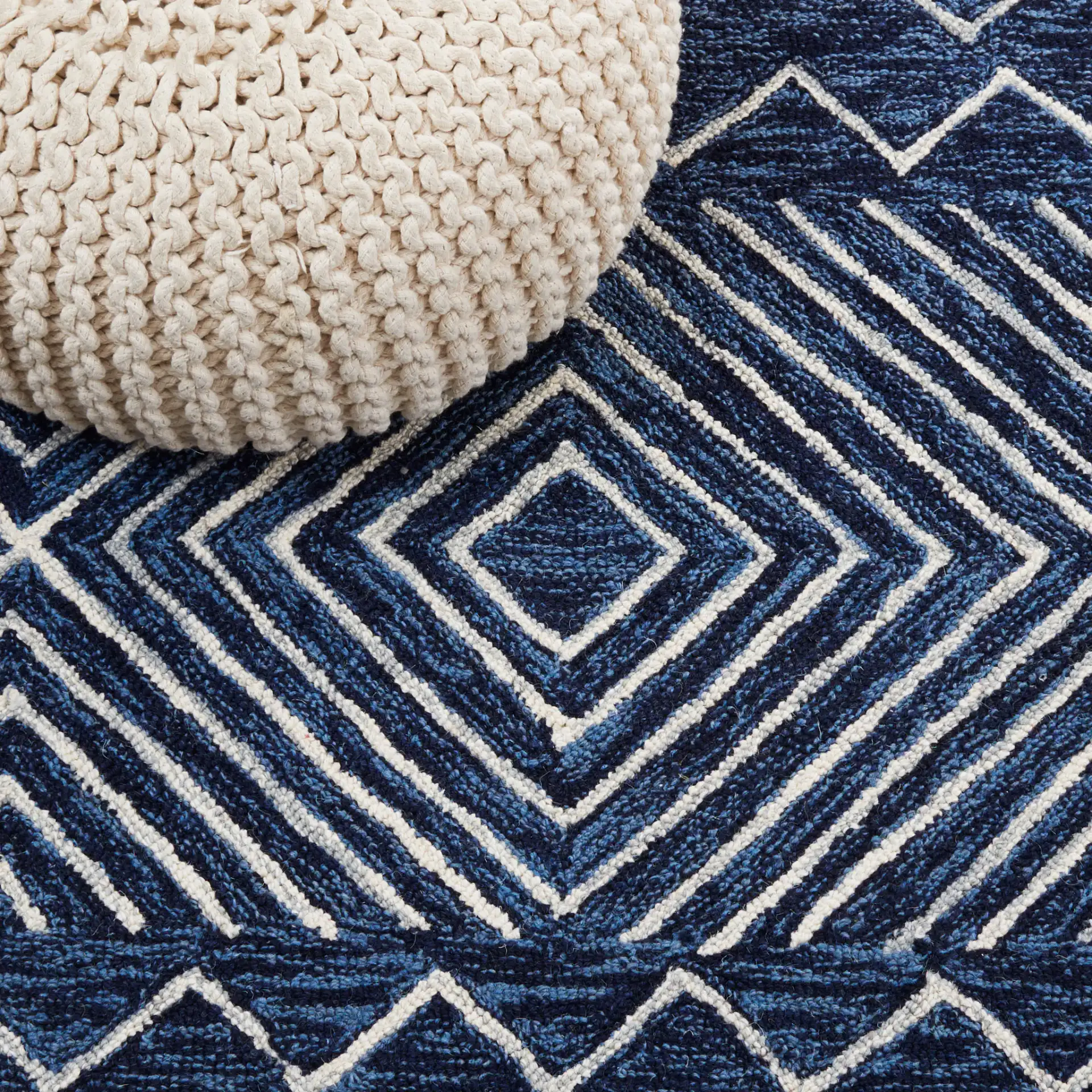 Metro Diamond Banded Hand-Tufted Wool Rug in Navy / Ivory in a styled room