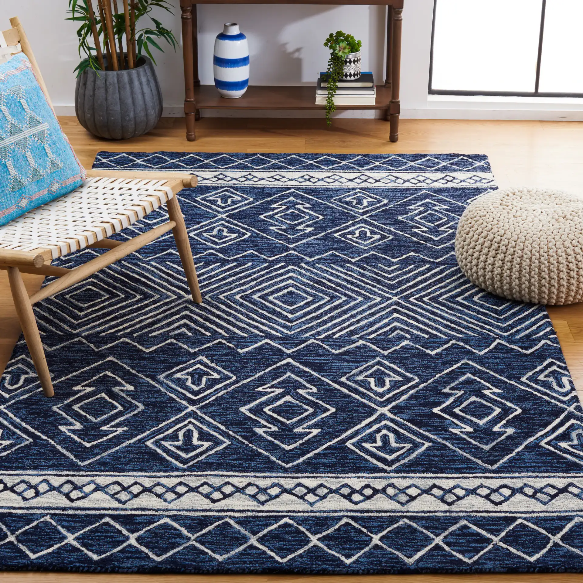 Metro Diamond Banded Hand-Tufted Wool Rug in Navy / Ivory in a styled room