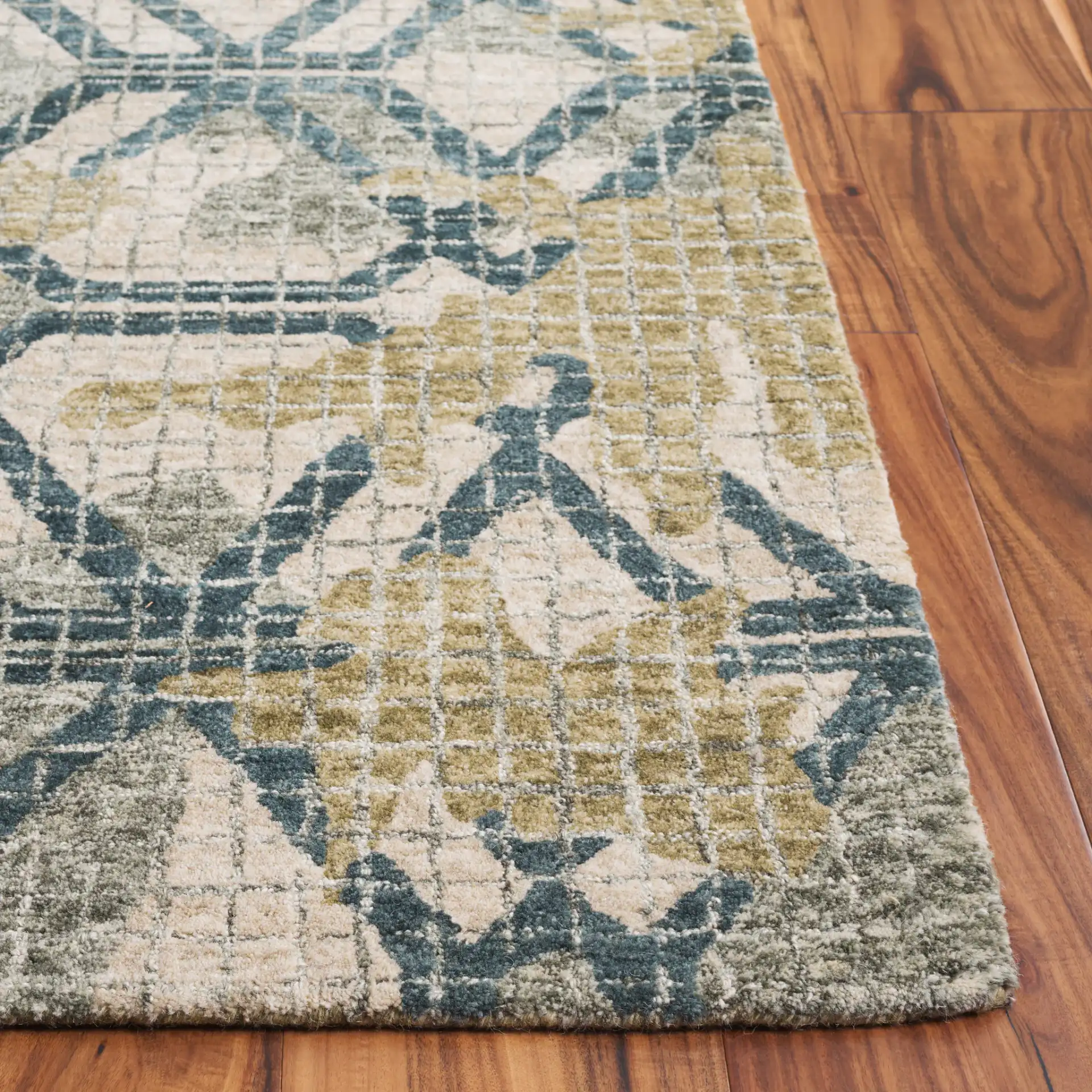 Metro Lattice Hand-Tufted Wool Rug in Green / Beige in a styled room
