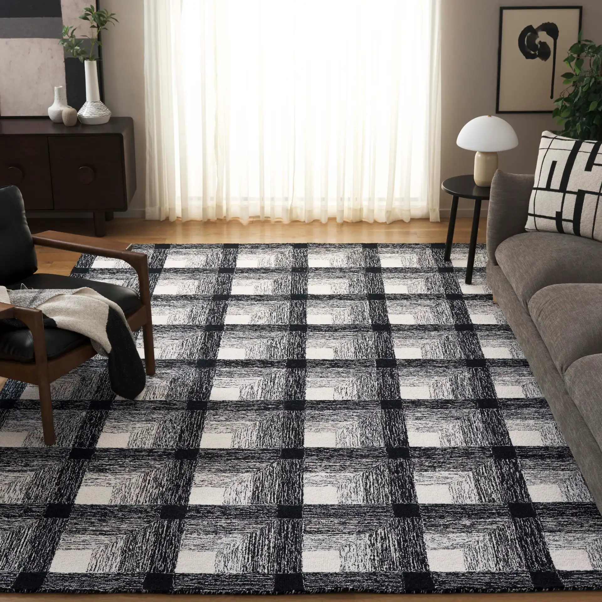 Metro Optical Grid Hand-Tufted Wool Rug in Charcoal / Ivory in a styled room
