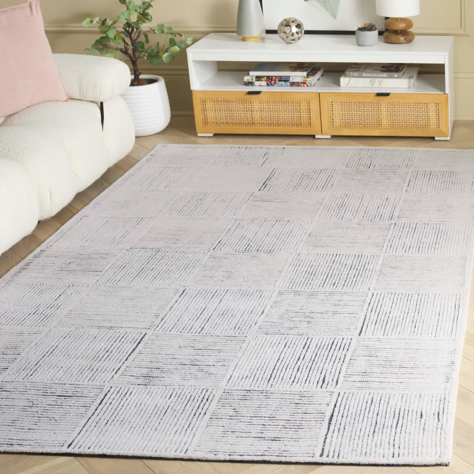 Metro Modern Checkerboard Hand-Tufted Wool Rug in Ivory / Charcoal in a styled room
