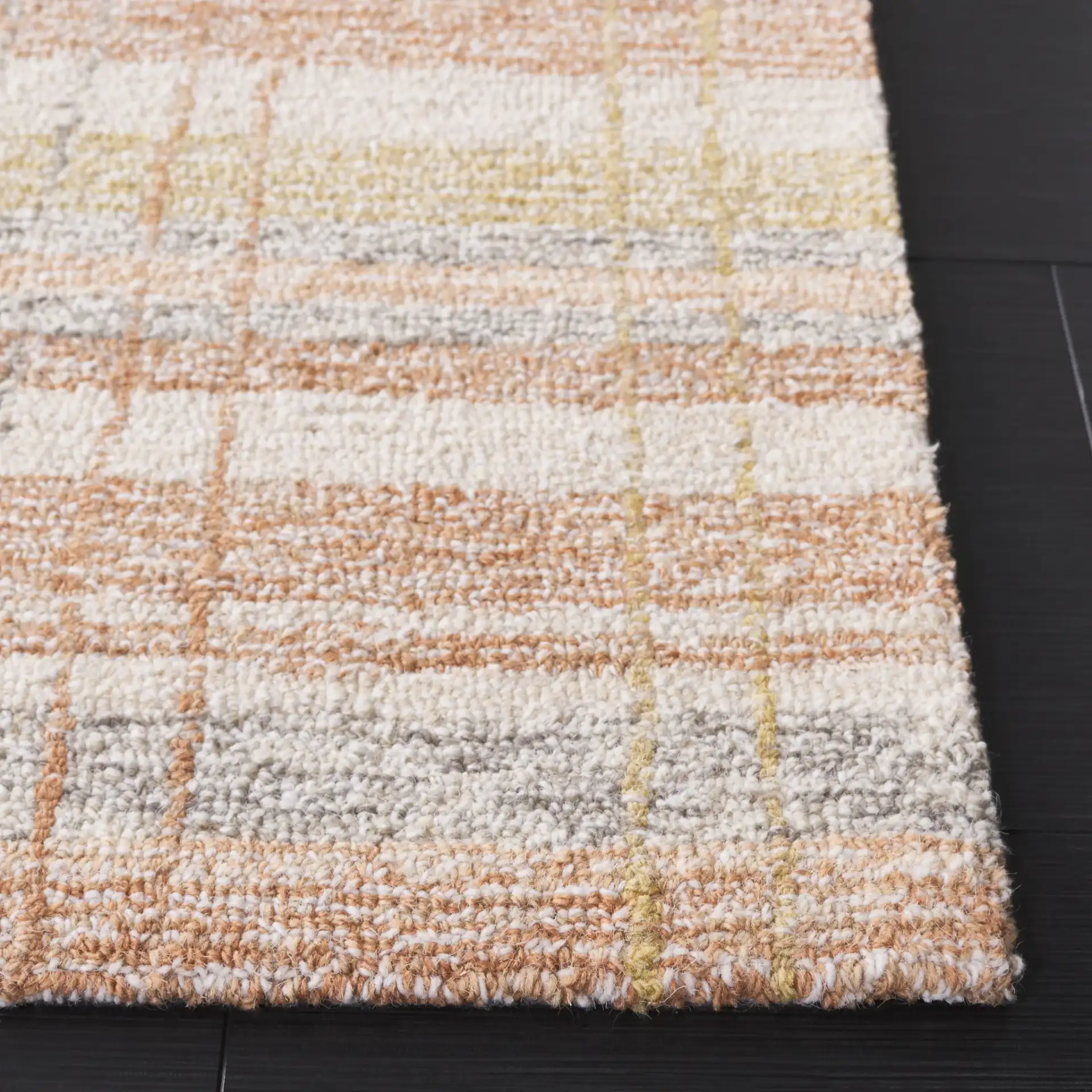 Metro Plaid Hand-Tufted Rug in Ivory / Rust in a styled room