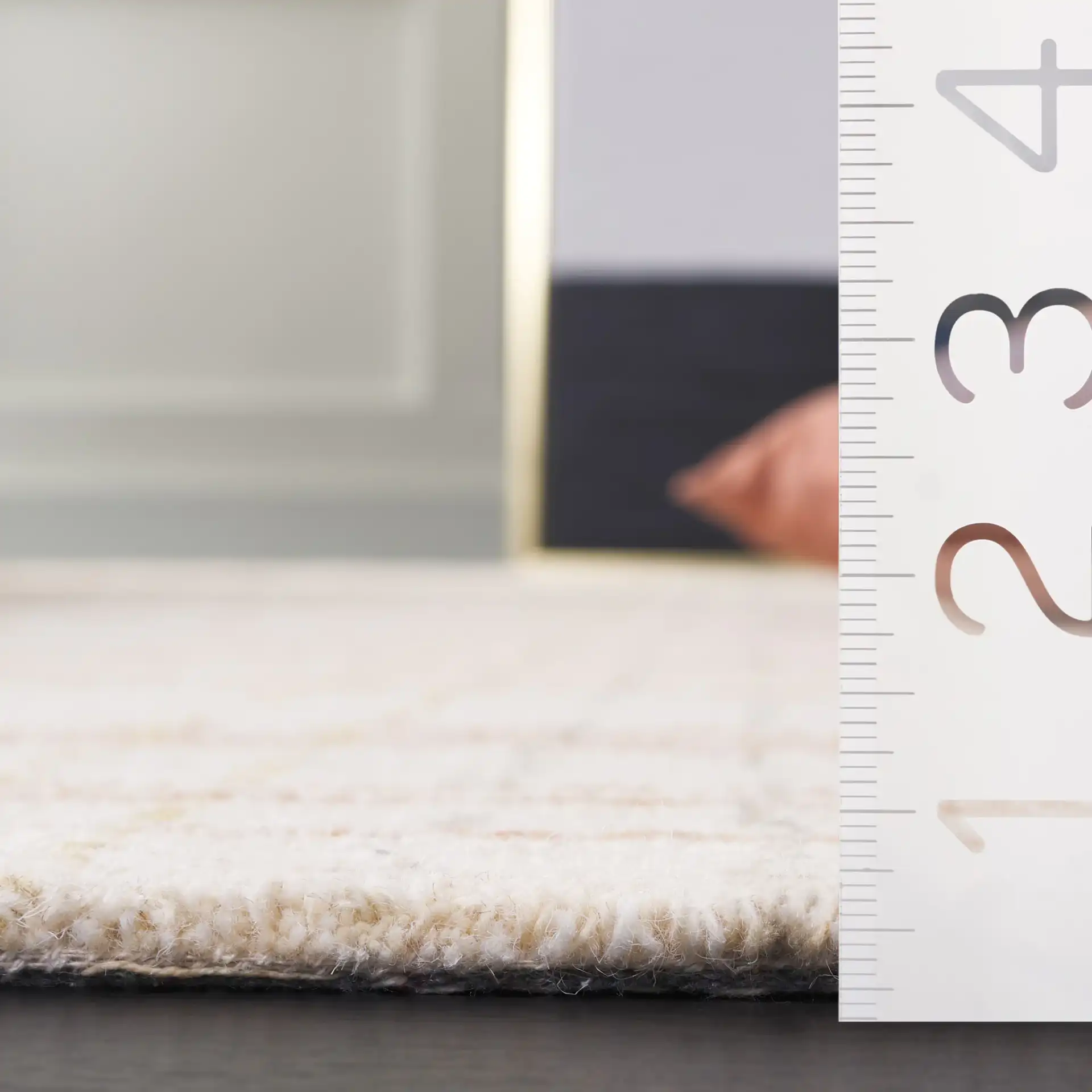 Metro Plaid Hand-Tufted Rug in Ivory / Rust in a styled room