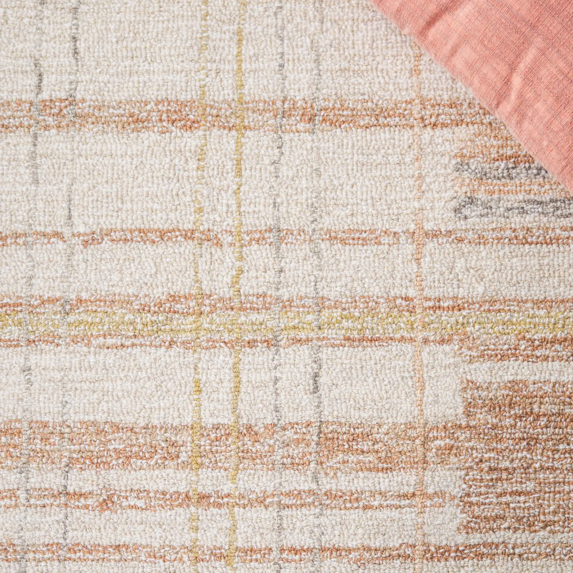 Metro Plaid Hand-Tufted Rug in Ivory / Rust in a styled room