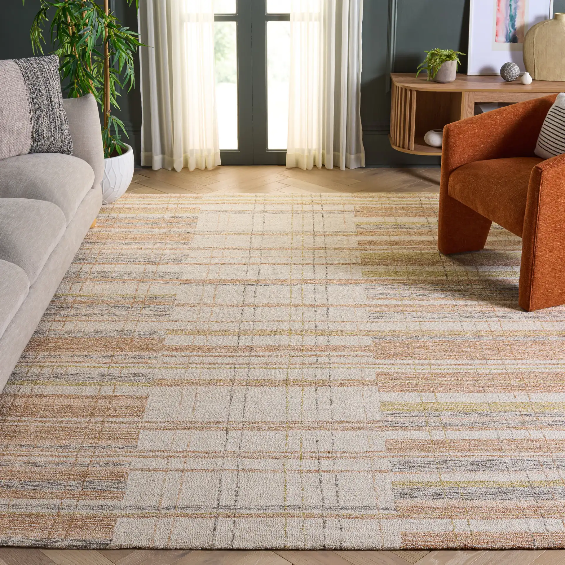 Metro Plaid Hand-Tufted Rug in Ivory / Rust in a styled room