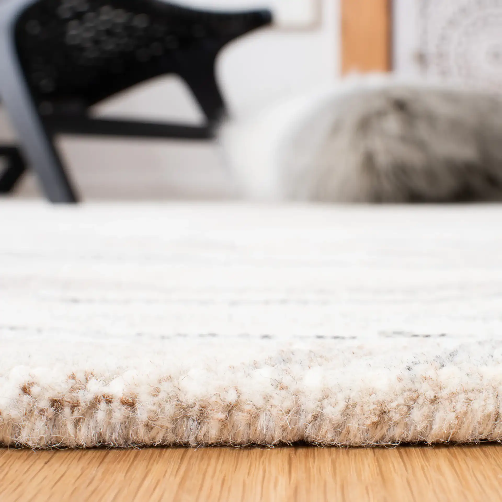Metro Wavy Line Hand-Tufted Wool Rug in Ivory / Gray in a styled room