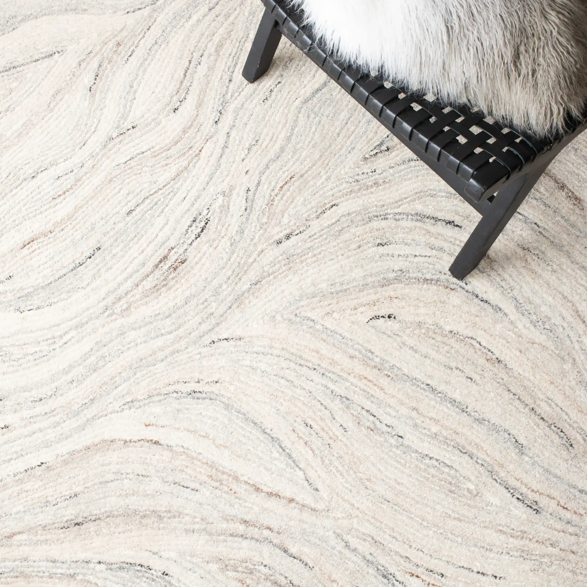 Metro Wavy Line Hand-Tufted Wool Rug in Ivory / Gray in a styled room