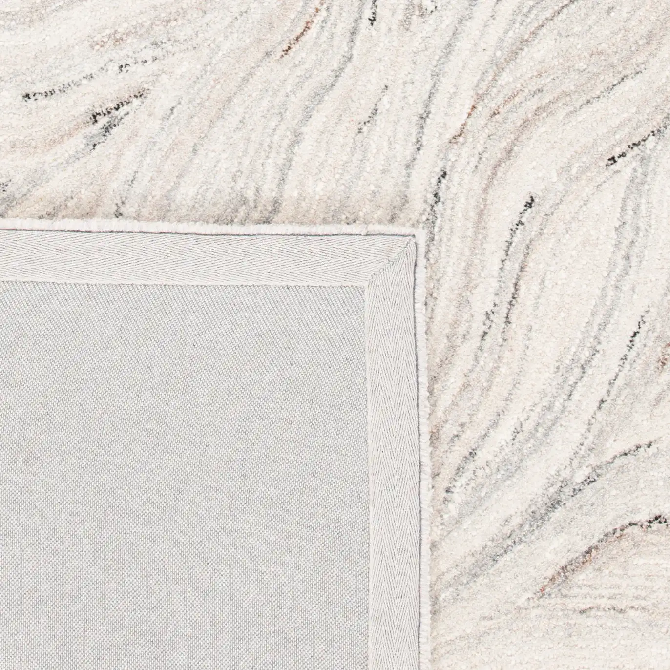Metro Wavy Line Hand-Tufted Wool Rug in Ivory / Gray in a styled room
