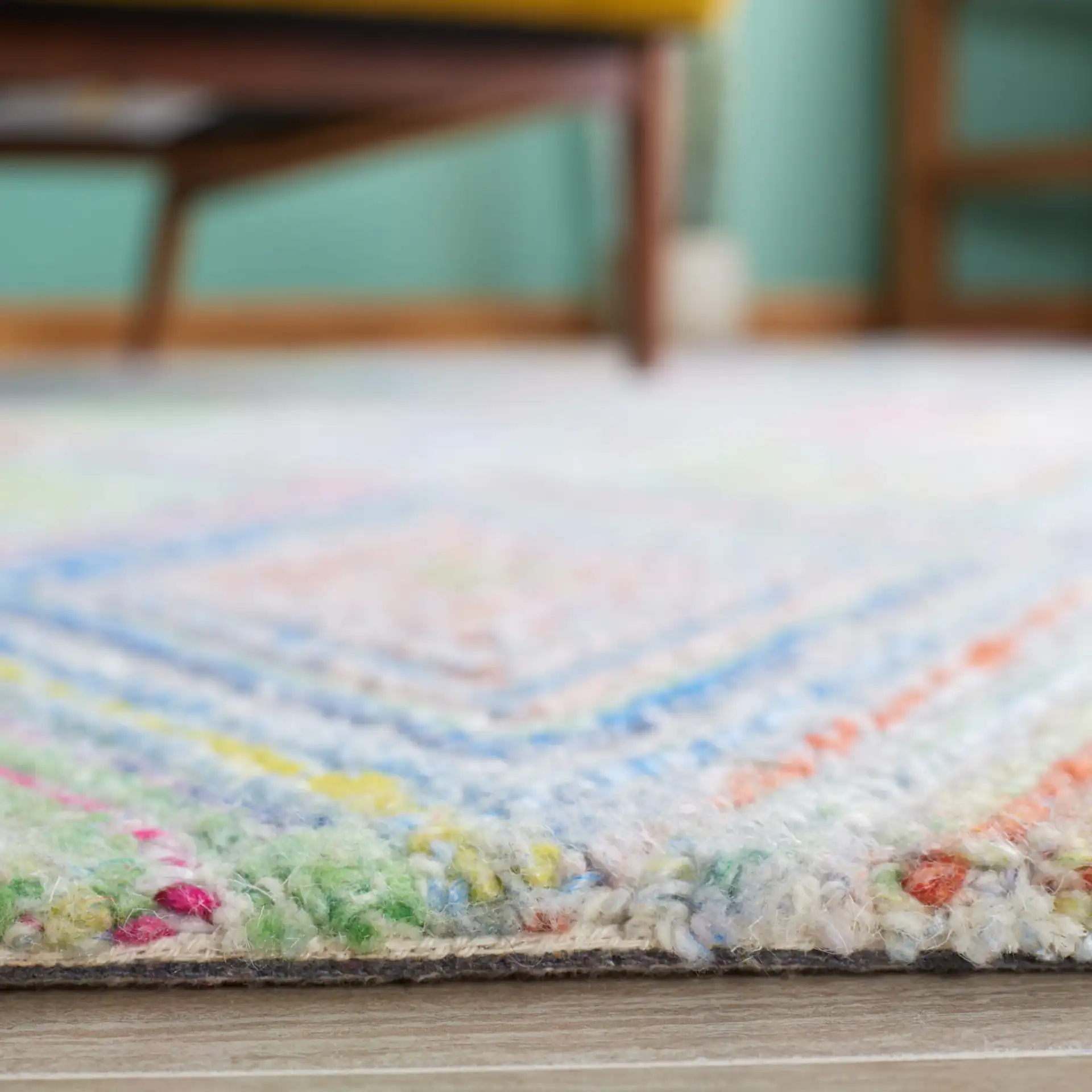 Metro Concentric Diamond Hand-Tufted Rug in Blue / Green in a styled room